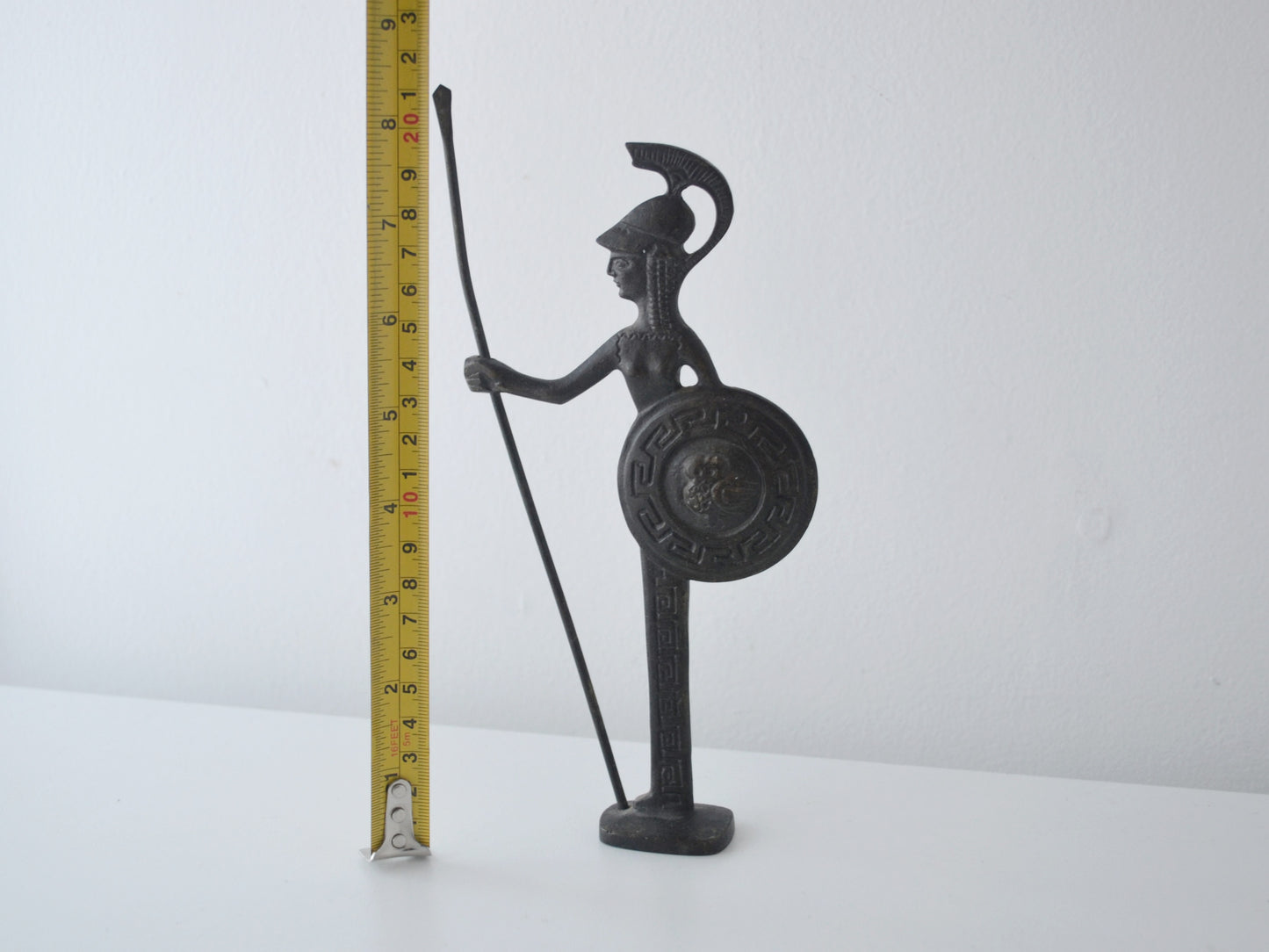 Height measurement of vintage Greek bronze Athena figurine showing 21cm, dark natural patina