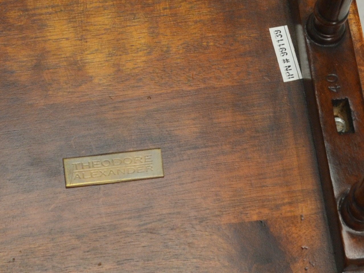 Theodore Alexander brass maker's plaque to underside of mahogany nesting table.