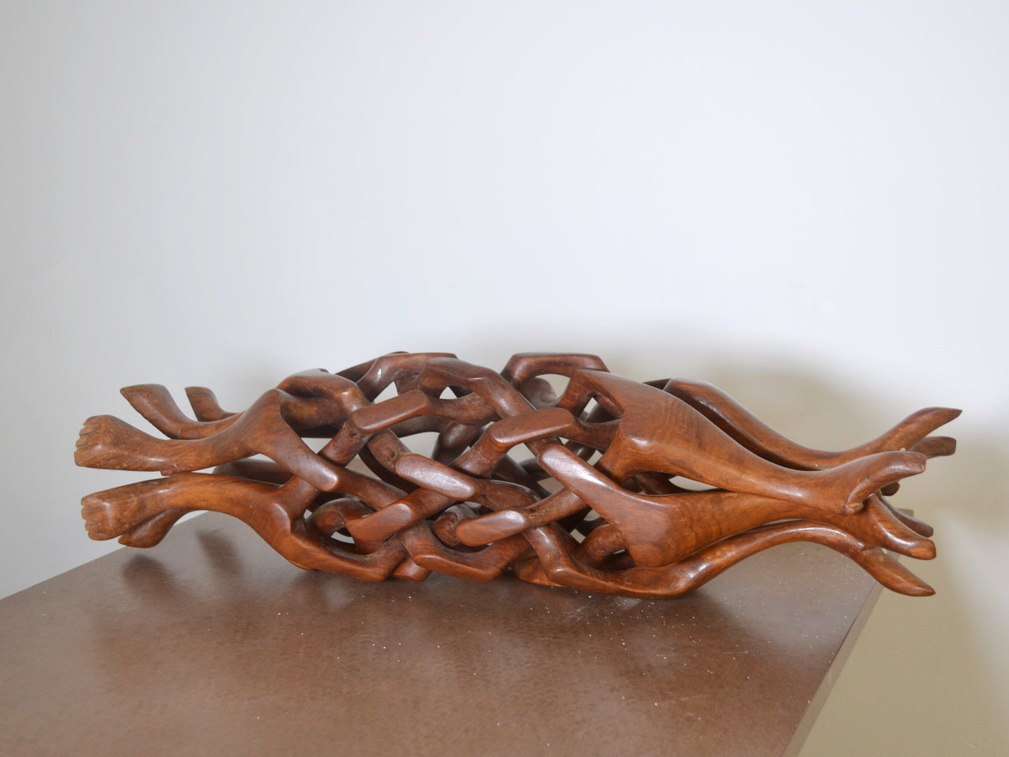 Chain-carved hardwood dog figures bowl stand with hand-painted Moroccan ceramic, circa 1960s, rear view.