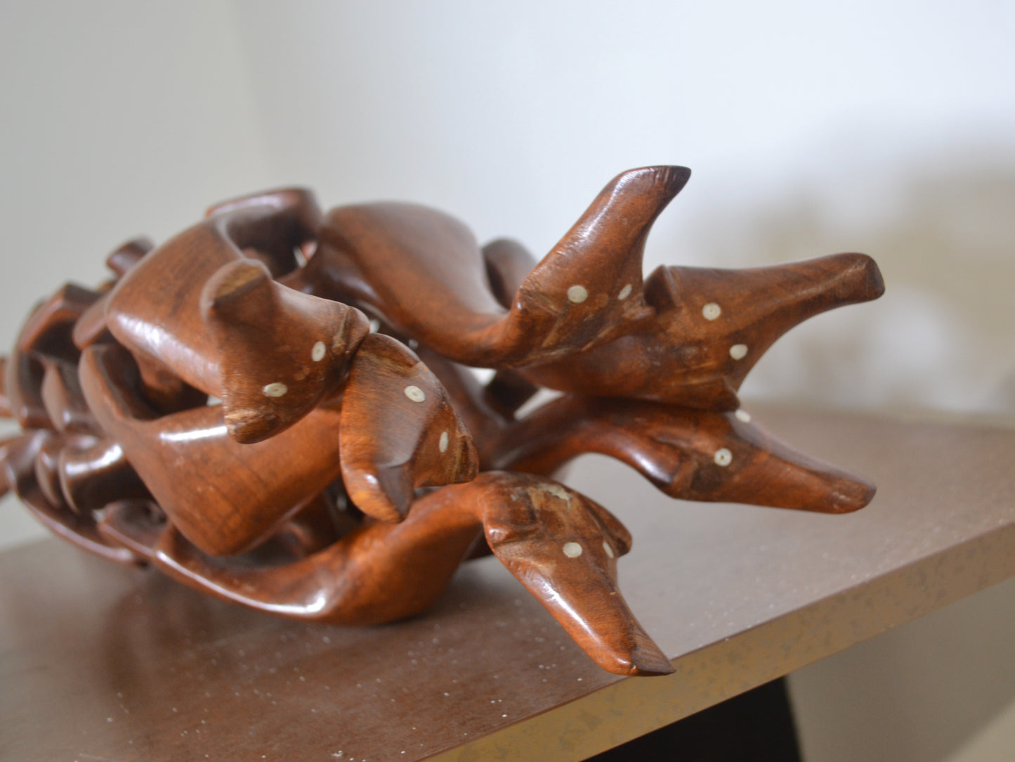 Hand-carved hardwood six dog figures stand, chain carving tradition, circa 1960s, top view.