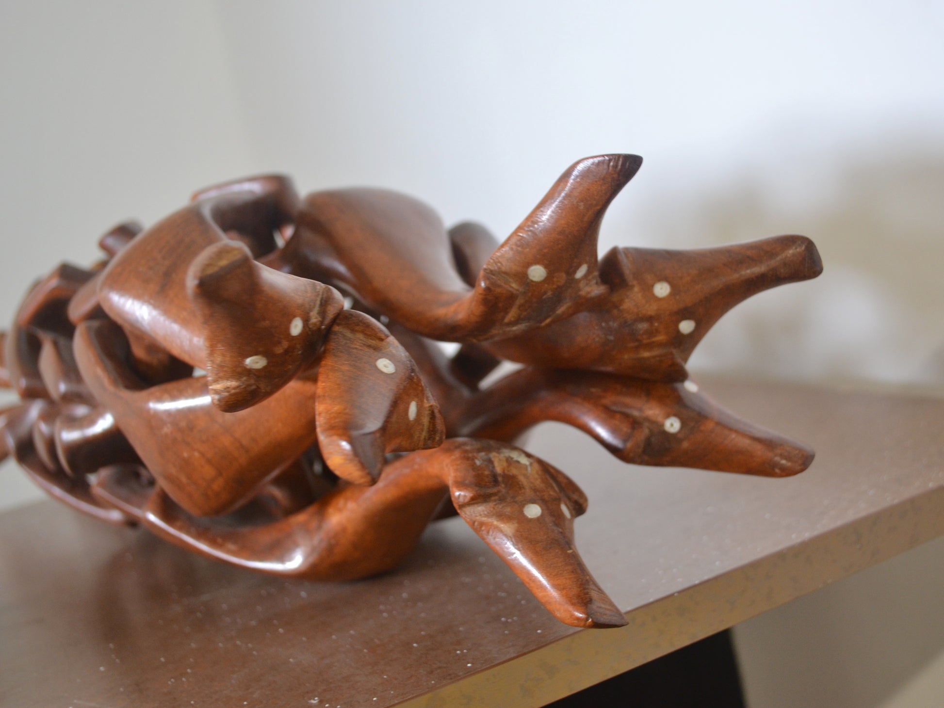 Hand-carved hardwood six dog figures stand, chain carving tradition, circa 1960s, top view.