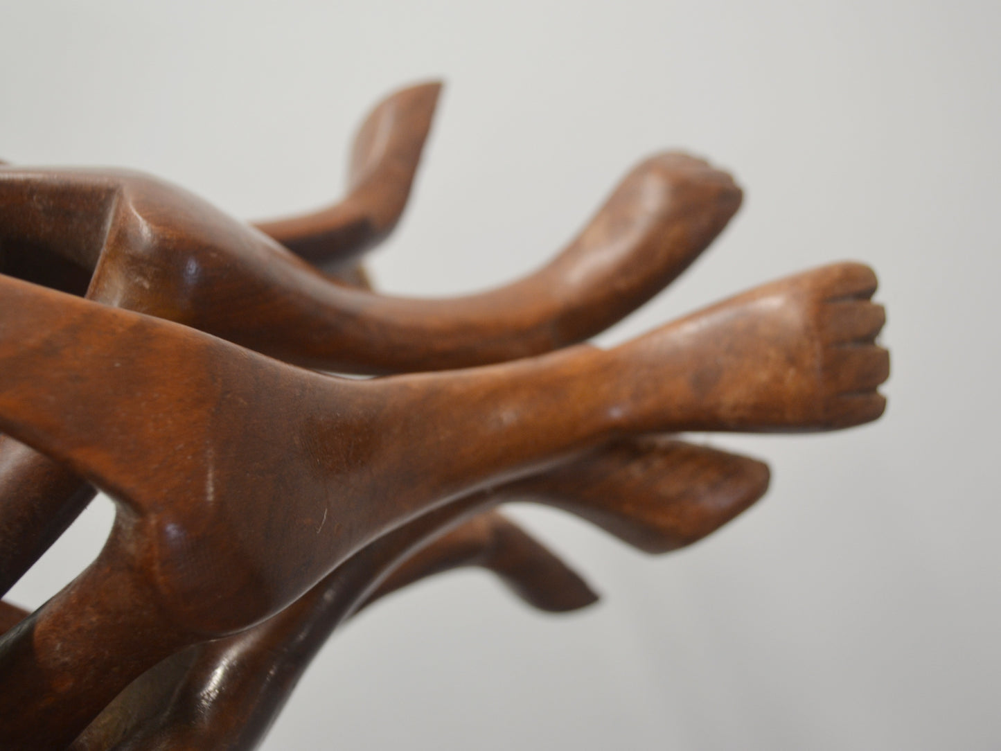 Carved paw feet detail of hardwood dog figures stand, folk art, circa 1960s.