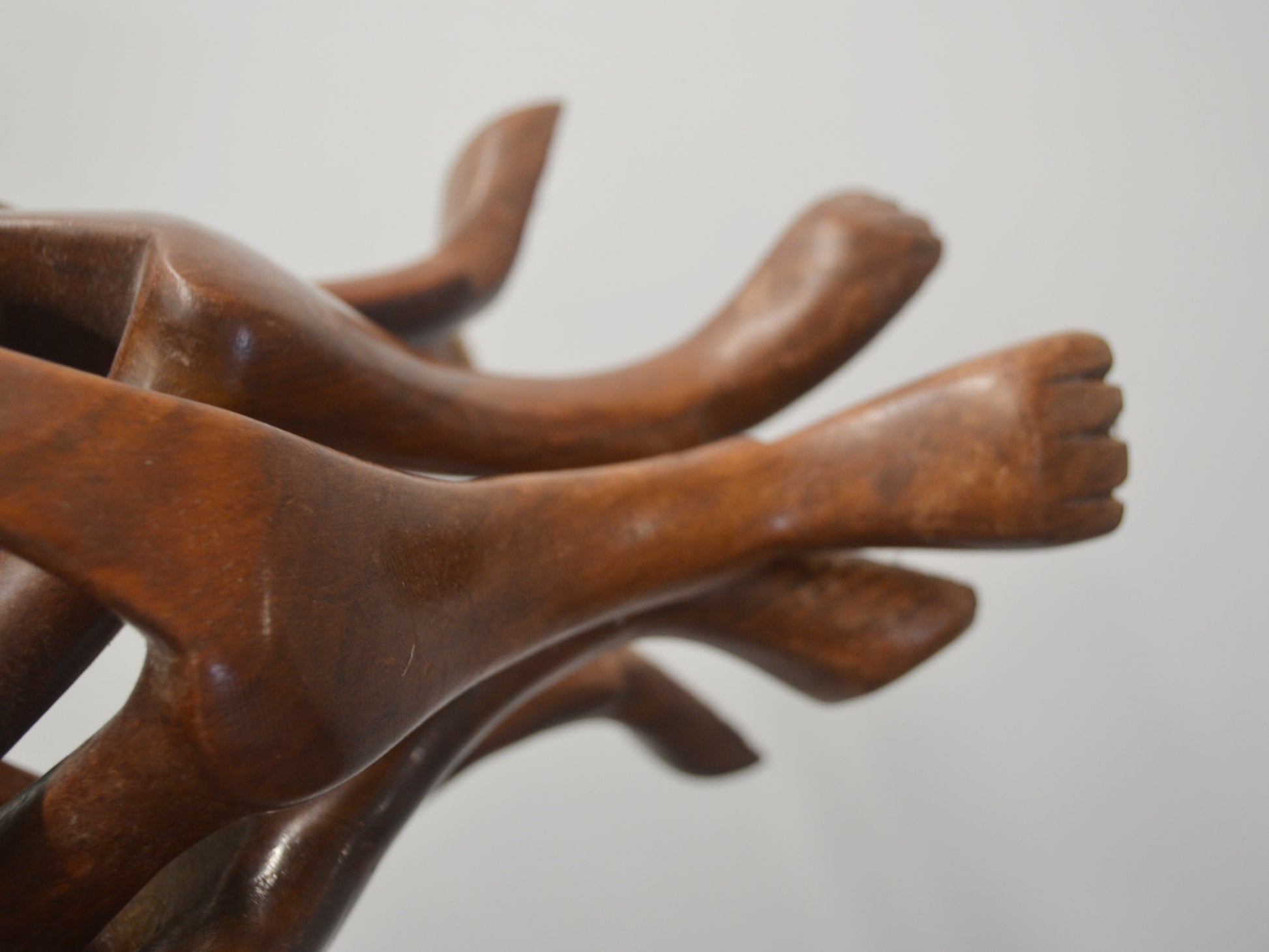 Carved paw feet detail of hardwood dog figures stand, folk art, circa 1960s.