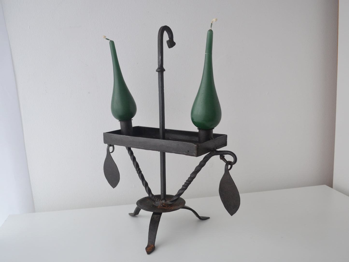 Hand-forged wrought iron candle stand, Arts & Crafts style, twisted legs and rectangular drip tray, side view