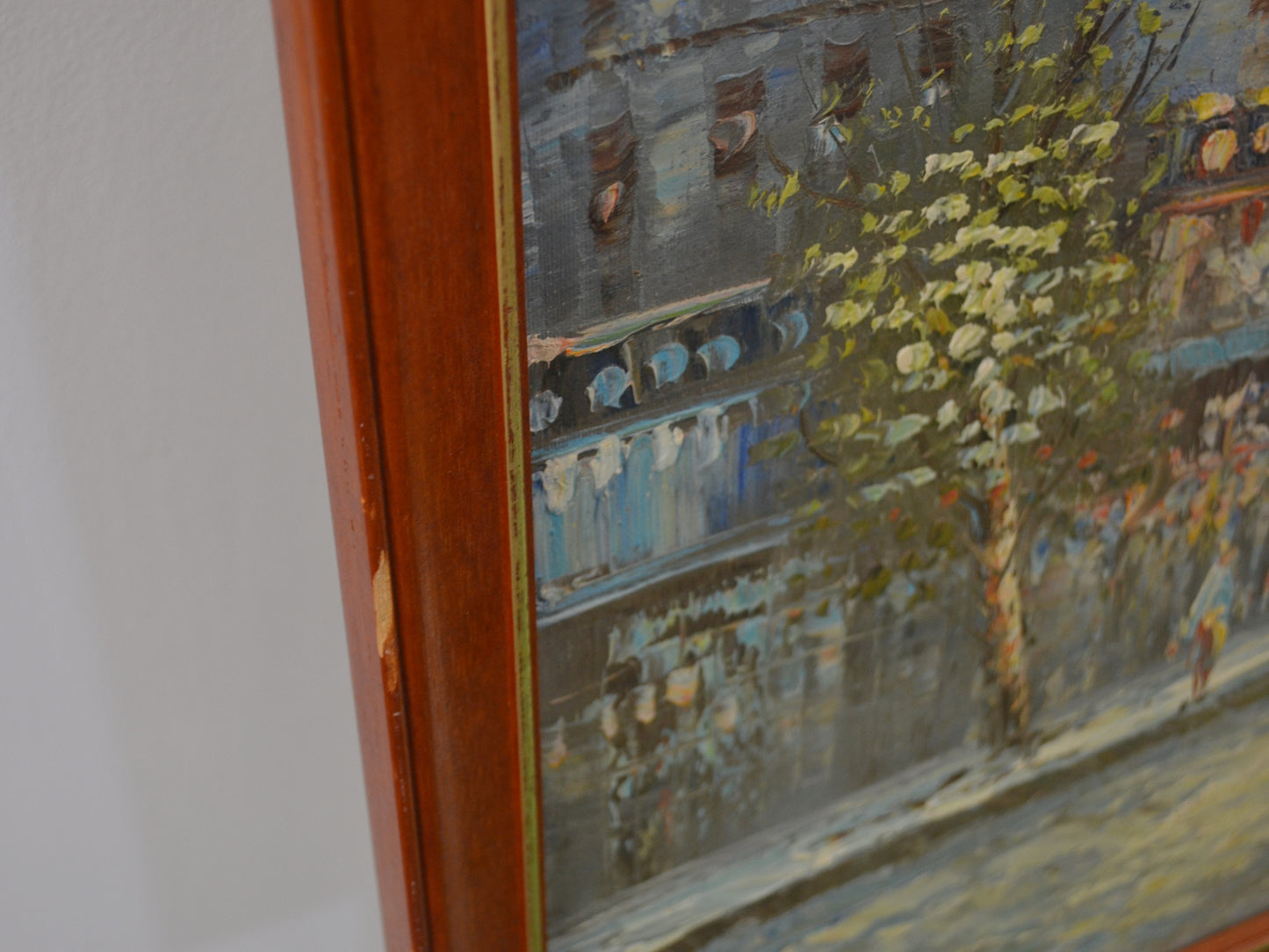 Frame chip detail, upper left corner, oil on board Paris street scene signed Burnett, circa 1960s.