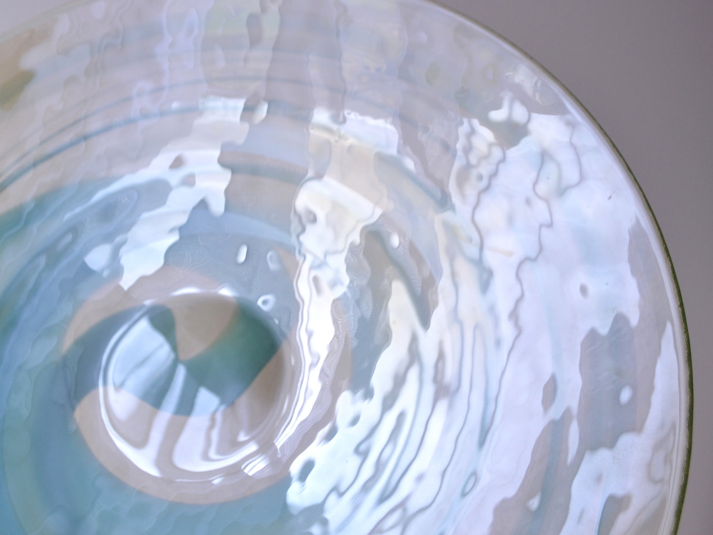 
Detail of aqua and teal spiral bands in warm yellow-tinted clear glass, hand-blown Murano centrepiece bowl, circa 1970s, surface texture