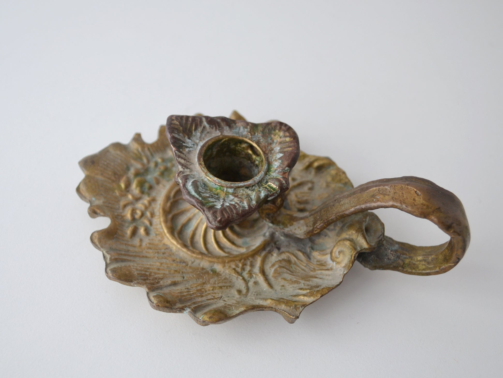 
Cast brass and bronze Art Nouveau chamberstick, scalloped drip tray with acanthus leaf relief, top view, European circa 1900
