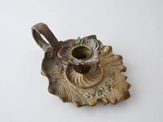 Cast brass and bronze Art Nouveau chamberstick, foliate relief, natural verdigris patina, European circa 1900, front view