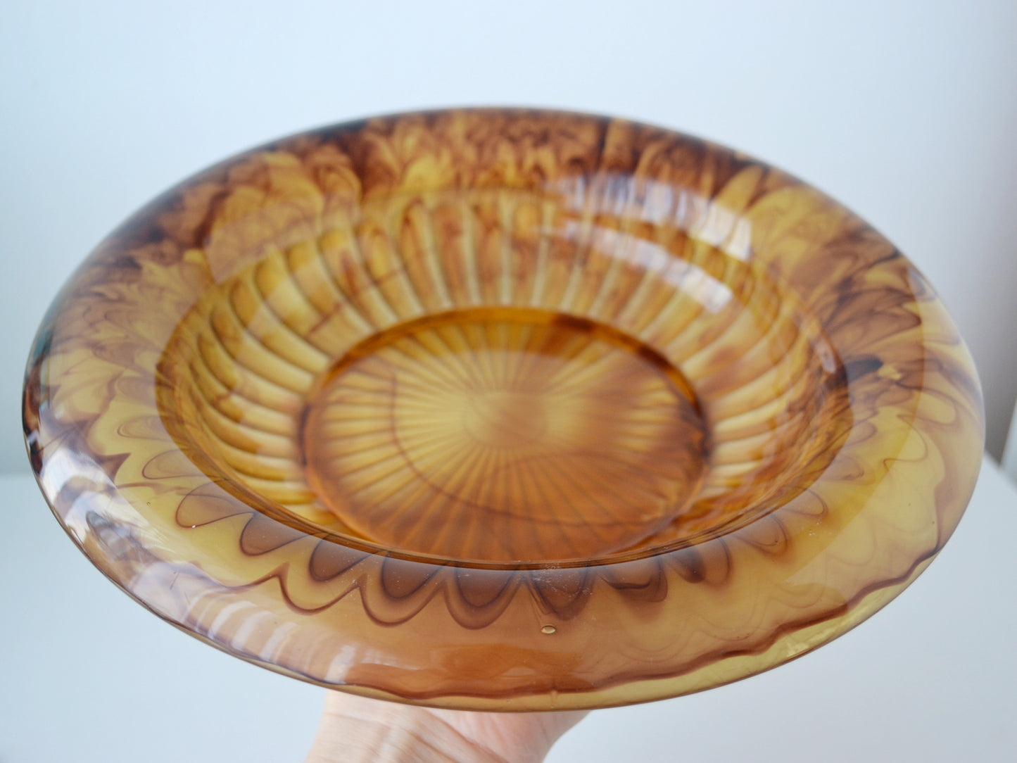 Close-up of tortoiseshell amber swirl in George Davidson Cloud Glass, natural air bubble inclusions visible