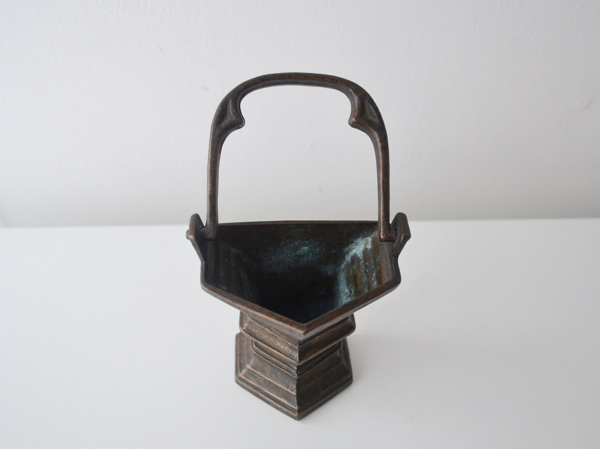 Trefoil arch handle detail of cast bronze Gothic Revival holy water stoup, European circa 1900, natural dark bronze patina