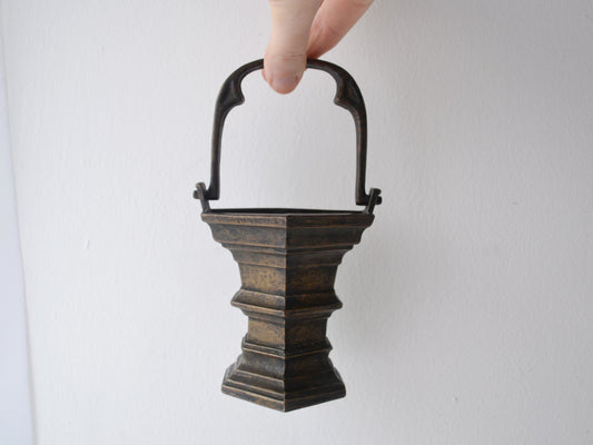 Cast bronze Gothic Revival holy water stoup, trefoil arch handle, stepped square base, natural dark patina, European circa 1900, front view