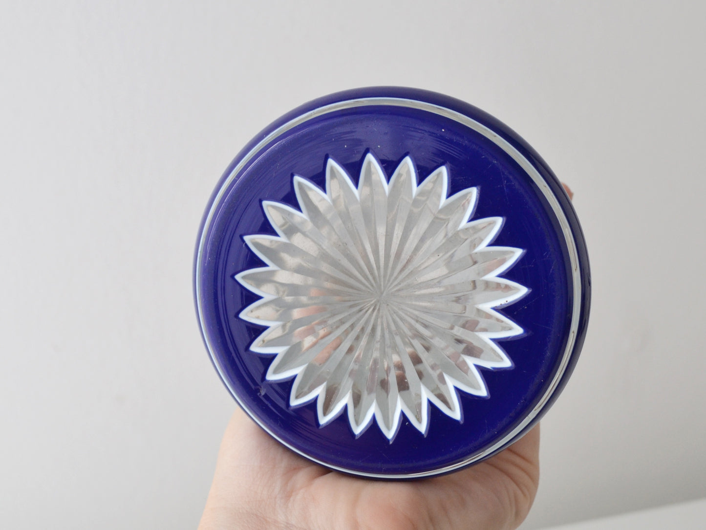 Detail of hand-cut foliate pattern with gilt traces on Bohemian cased glass scent bottle.