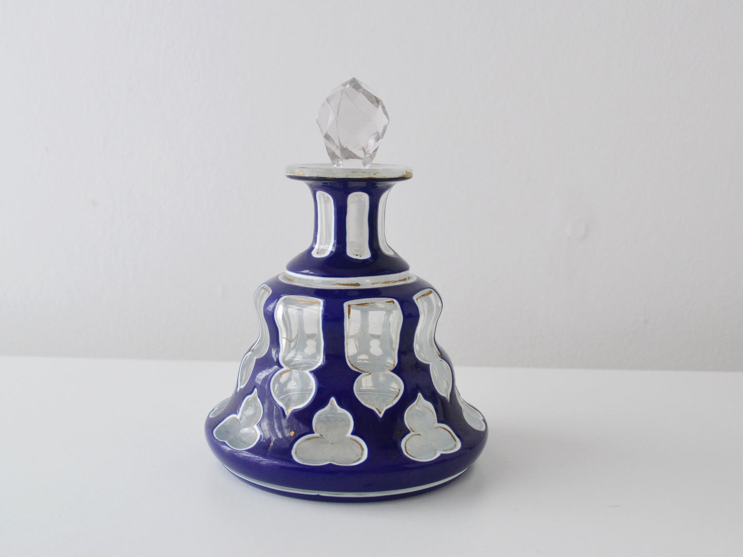 Antique Bohemian cased glass scent bottle, cobalt blue cut-to-clear overlay, 19th century, front view.