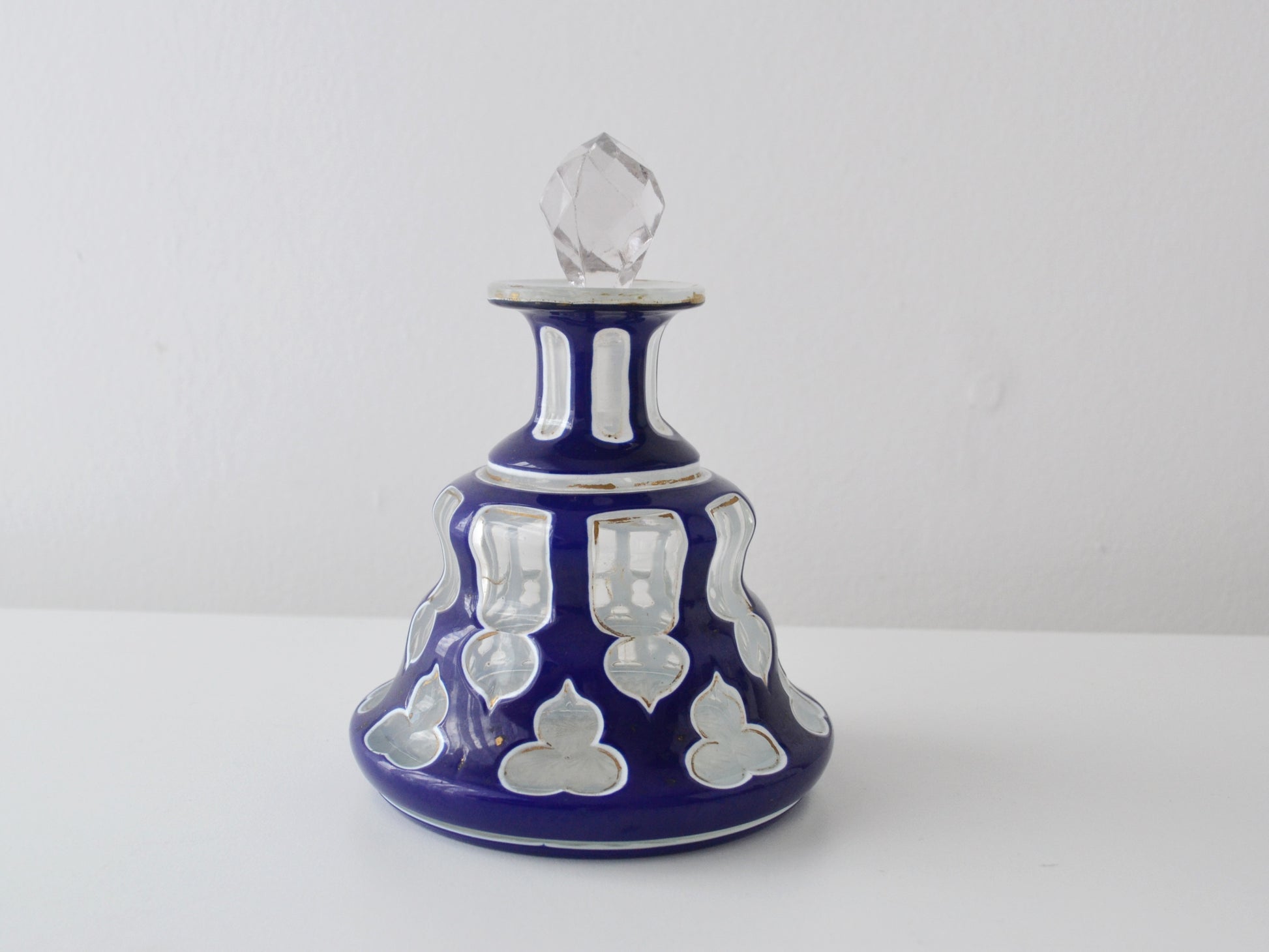 Antique Bohemian cased glass scent bottle, cobalt blue cut-to-clear overlay, 19th century, front view.