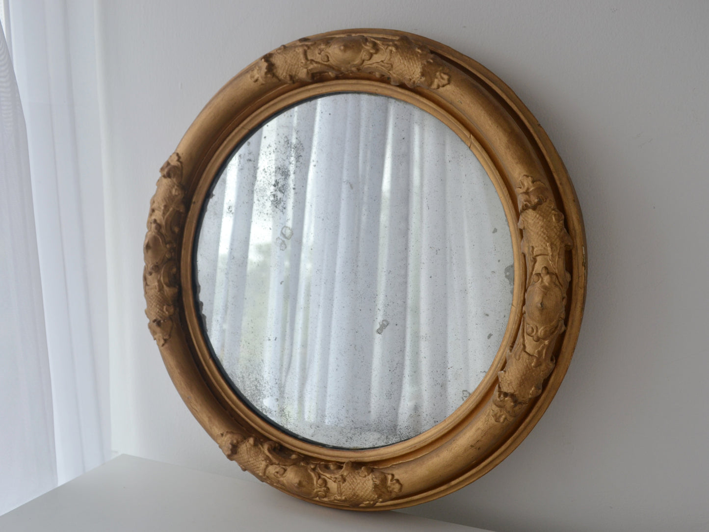 Antique Victorian round gesso barbola wall mirror gilt frame England circa 1880, foxed glass, front view