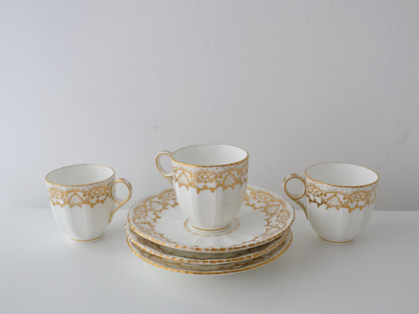 Davenport Longport Staffordshire Trio — Porcelain Cup & Saucer Set of Three, Gilt Scrollwork, England circa 1800–1830