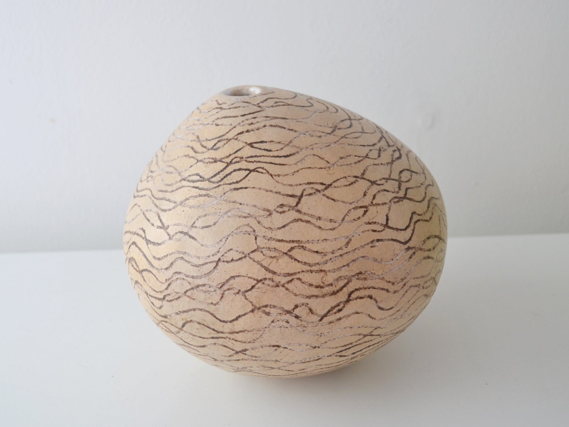 Sgraffito stoneware globe weed pot, European studio pottery, mid-late 20th century, front view.