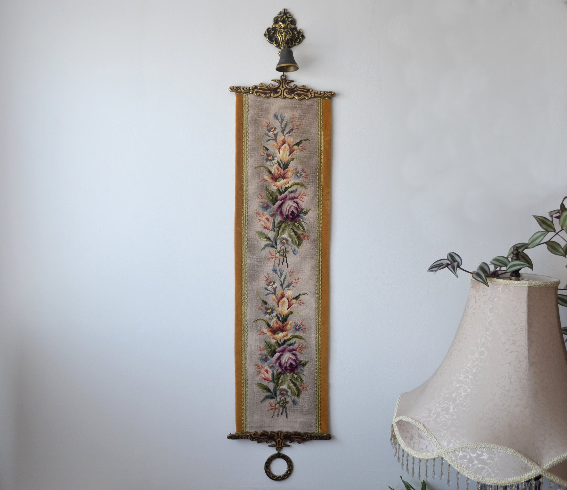 West German needlepoint floral bell pull, mid-century, circa 1950s–60s, complete with brass glockenspiel mount and weighted ring, full view.