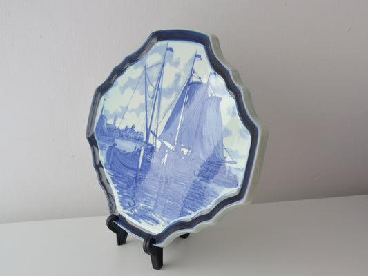 Boch Blue Delft octagonal charger, scalloped cobalt border, sailing vessels harbour scene, side angle view