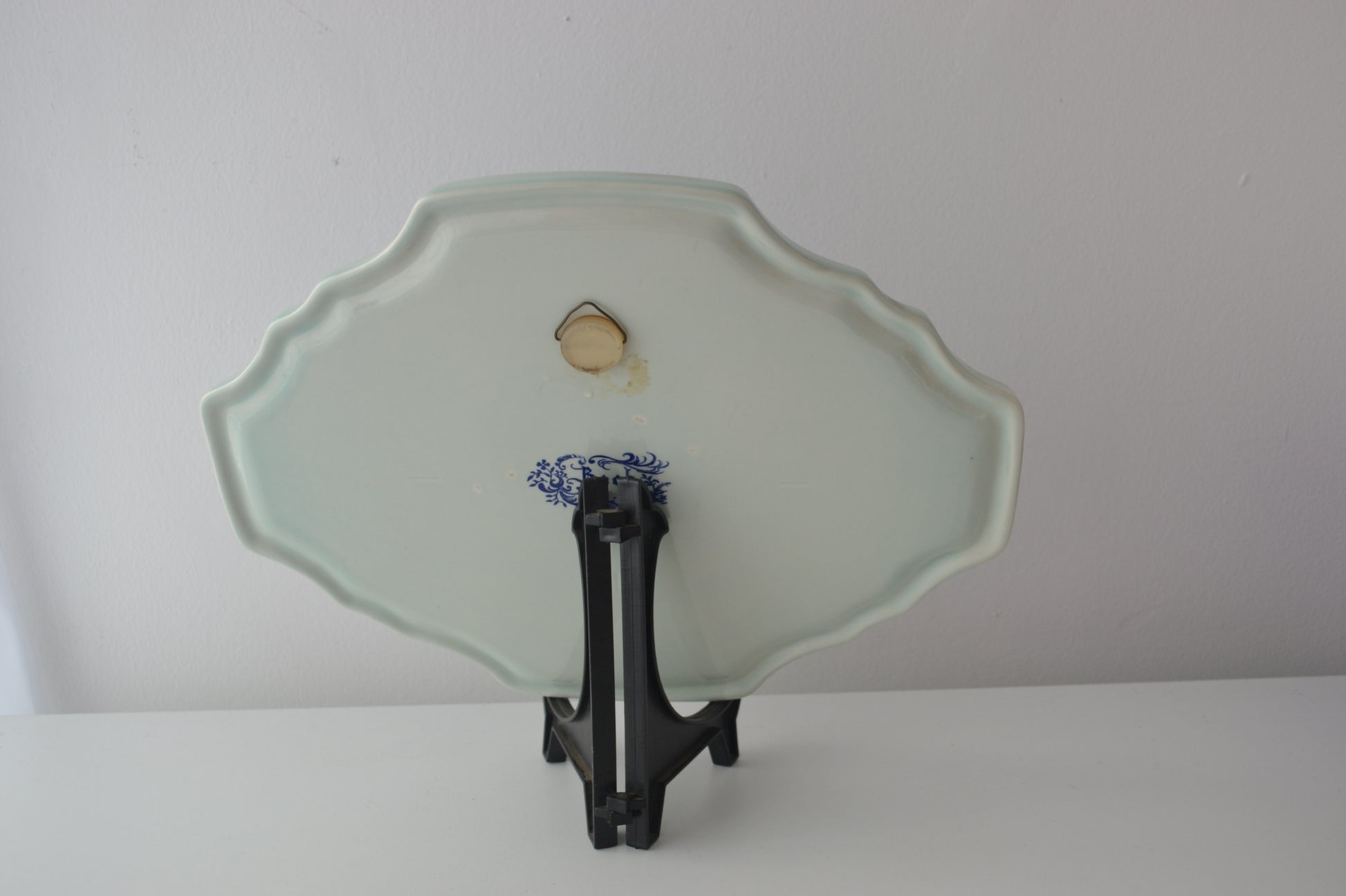 Reverse of Boch Blue Delft charger showing original manufacturer's stamp and hanging fixture, Belgium circa 1950s