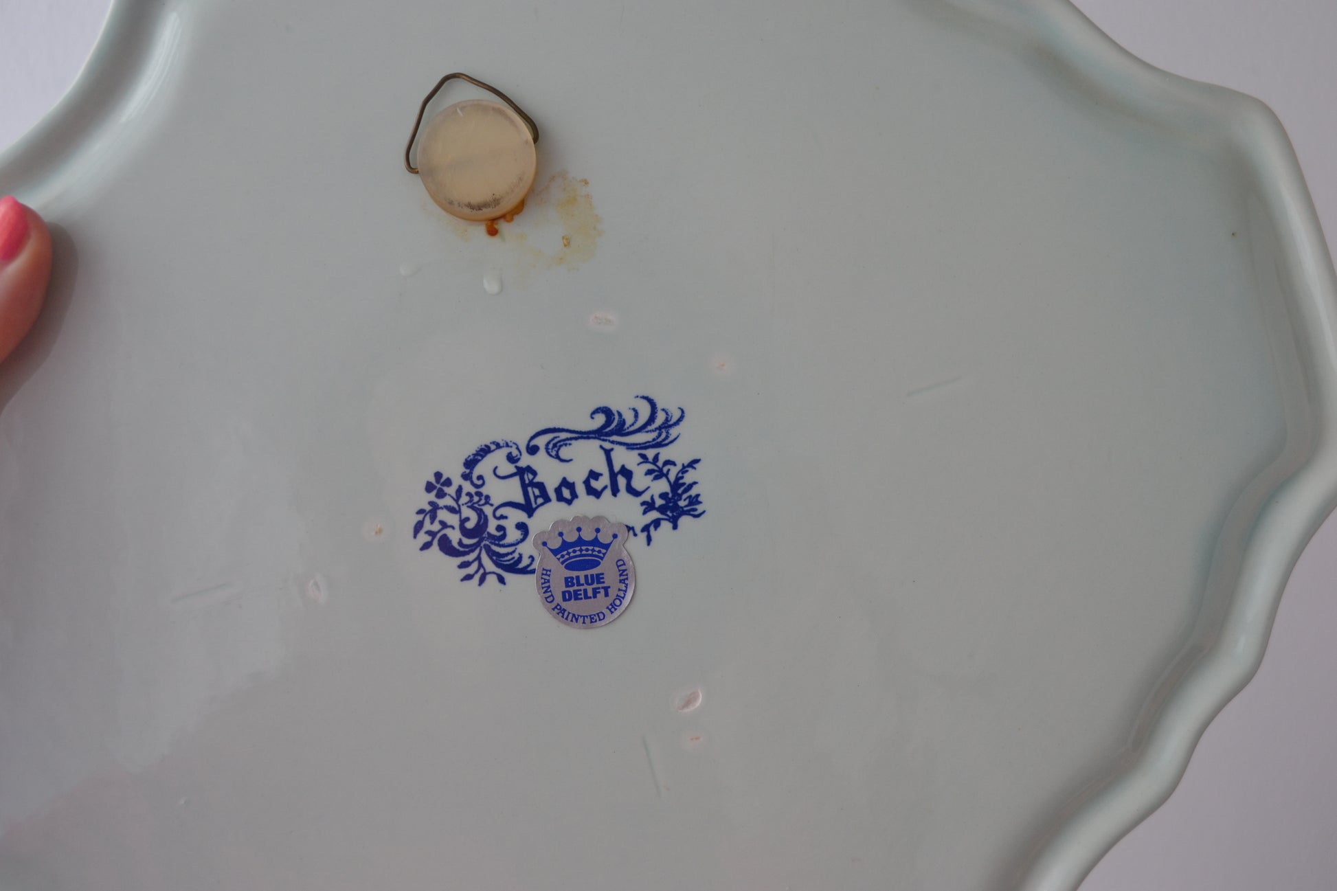 Reverse of Boch Blue Delft charger showing original manufacturer's stamp and hanging fixture, Belgium circa 1950s