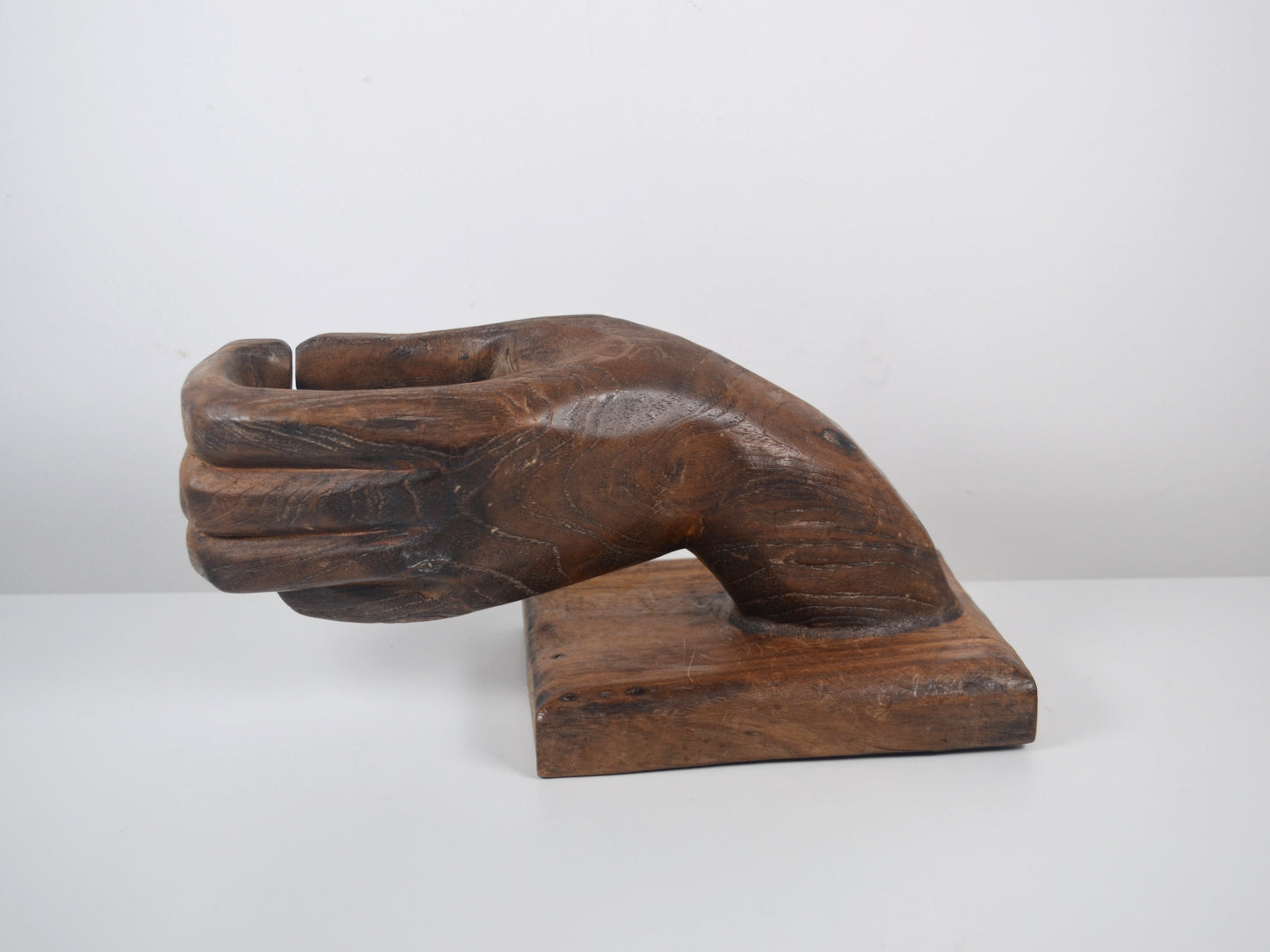 Wood grain and patina detail, hand-carved hardwood hand sculpture, circa 1960s–1970s.