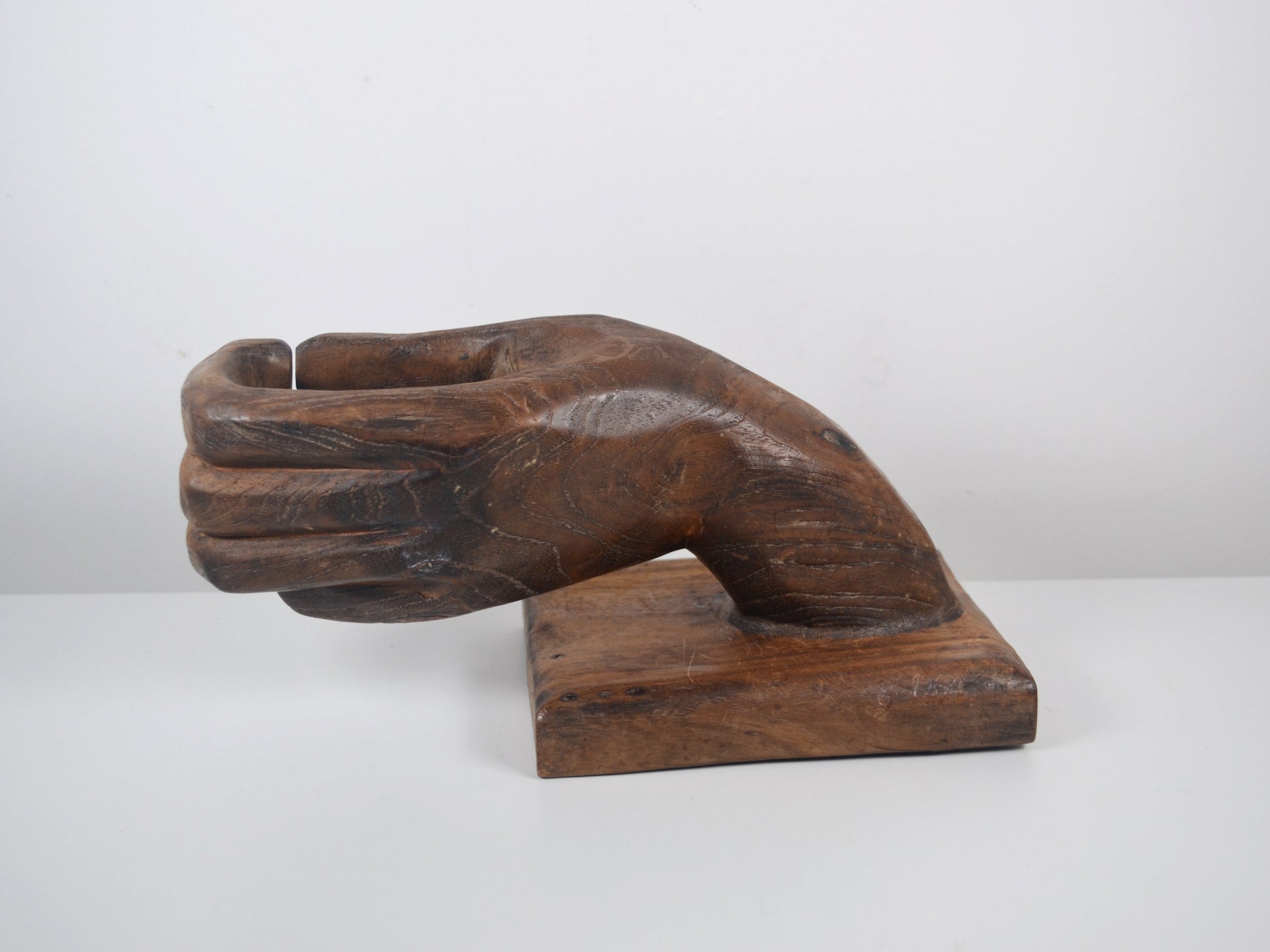 Wood grain and patina detail, hand-carved hardwood hand sculpture, circa 1960s–1970s.