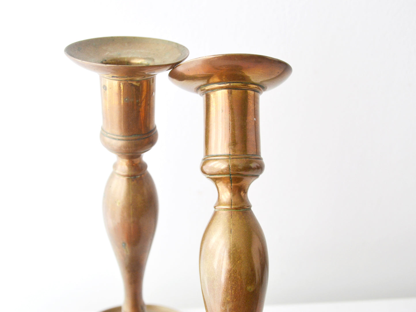 Cup nozzle detail of antique brass candlestick pair, hand-turned collar, original patina, circa 1780–1840