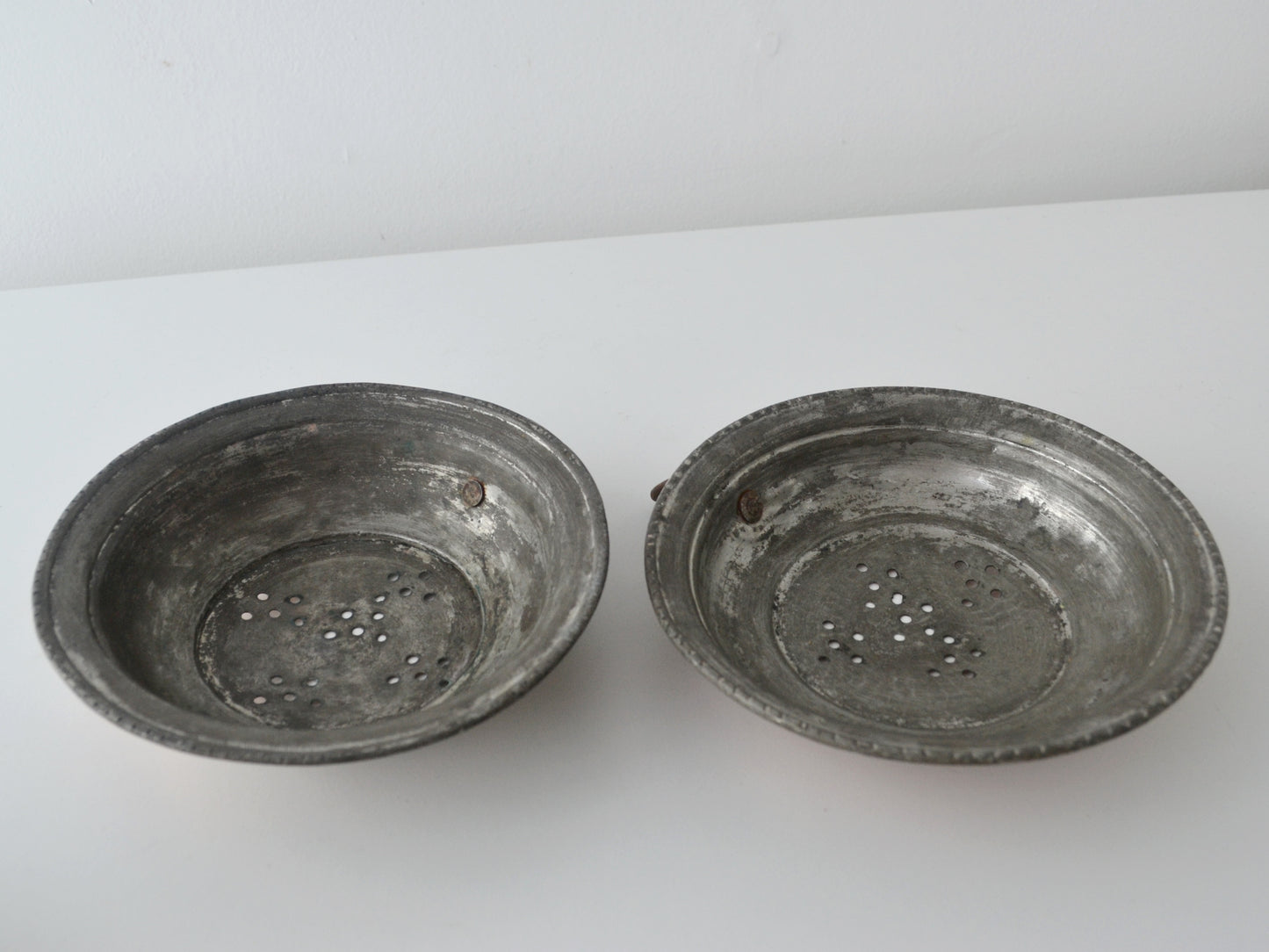 Interior view of antique French copper colander showing original tinning, partially worn, circa 19th century.