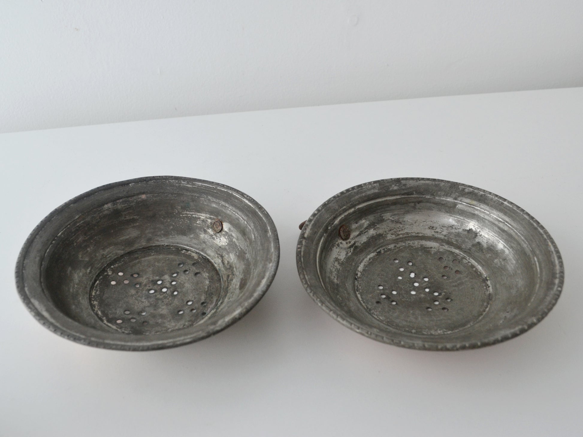 Interior view of antique French copper colander showing original tinning, partially worn, circa 19th century.