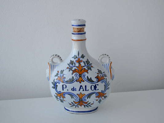 French faience apothecary jar albarello inscribed P. de ALOE, hand-painted, original cork, circa 18th–19th century, front view.