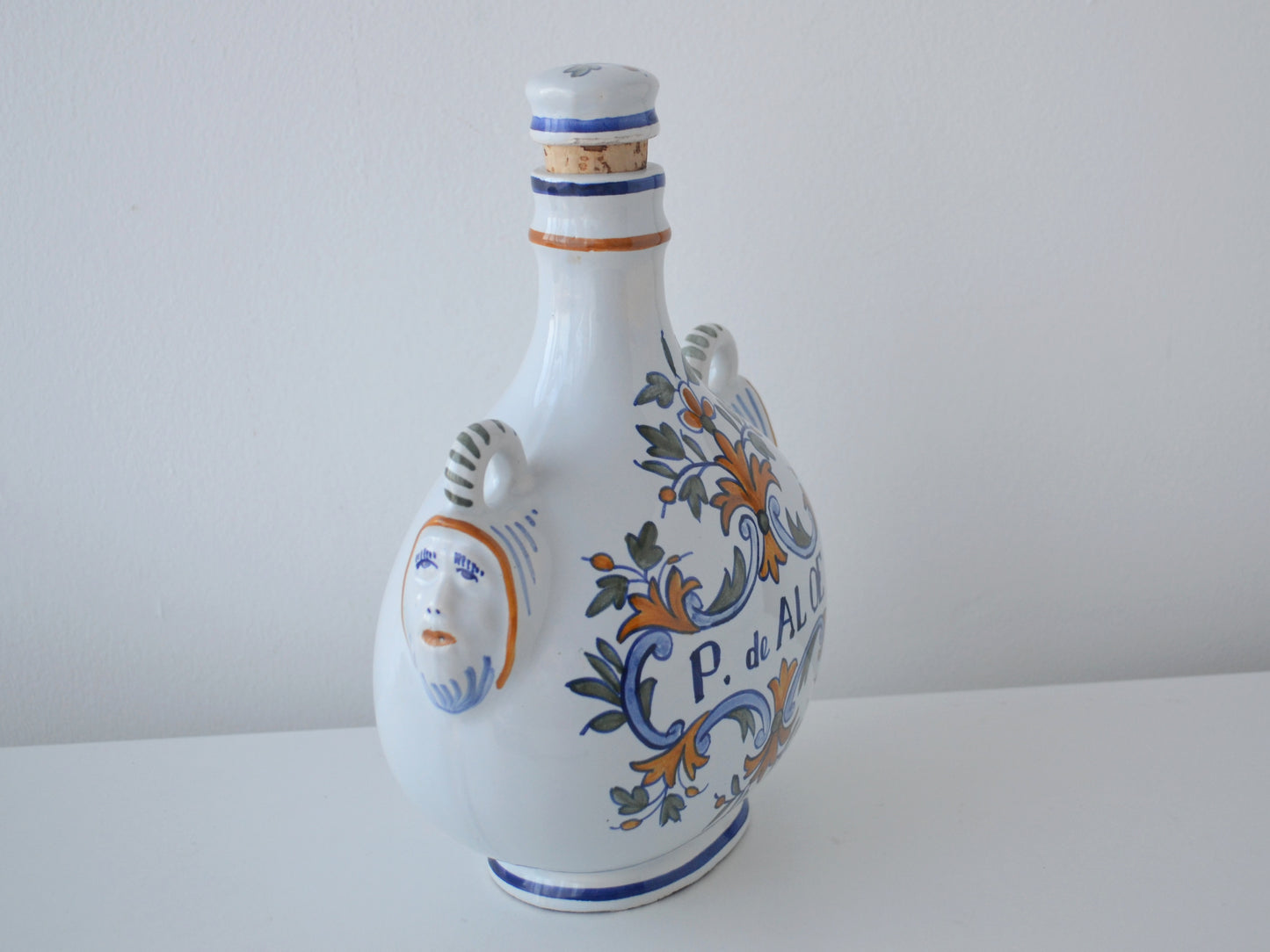 Maker's mark on base of French faience apothecary albarello P. de ALOE, circa 18th–19th century.