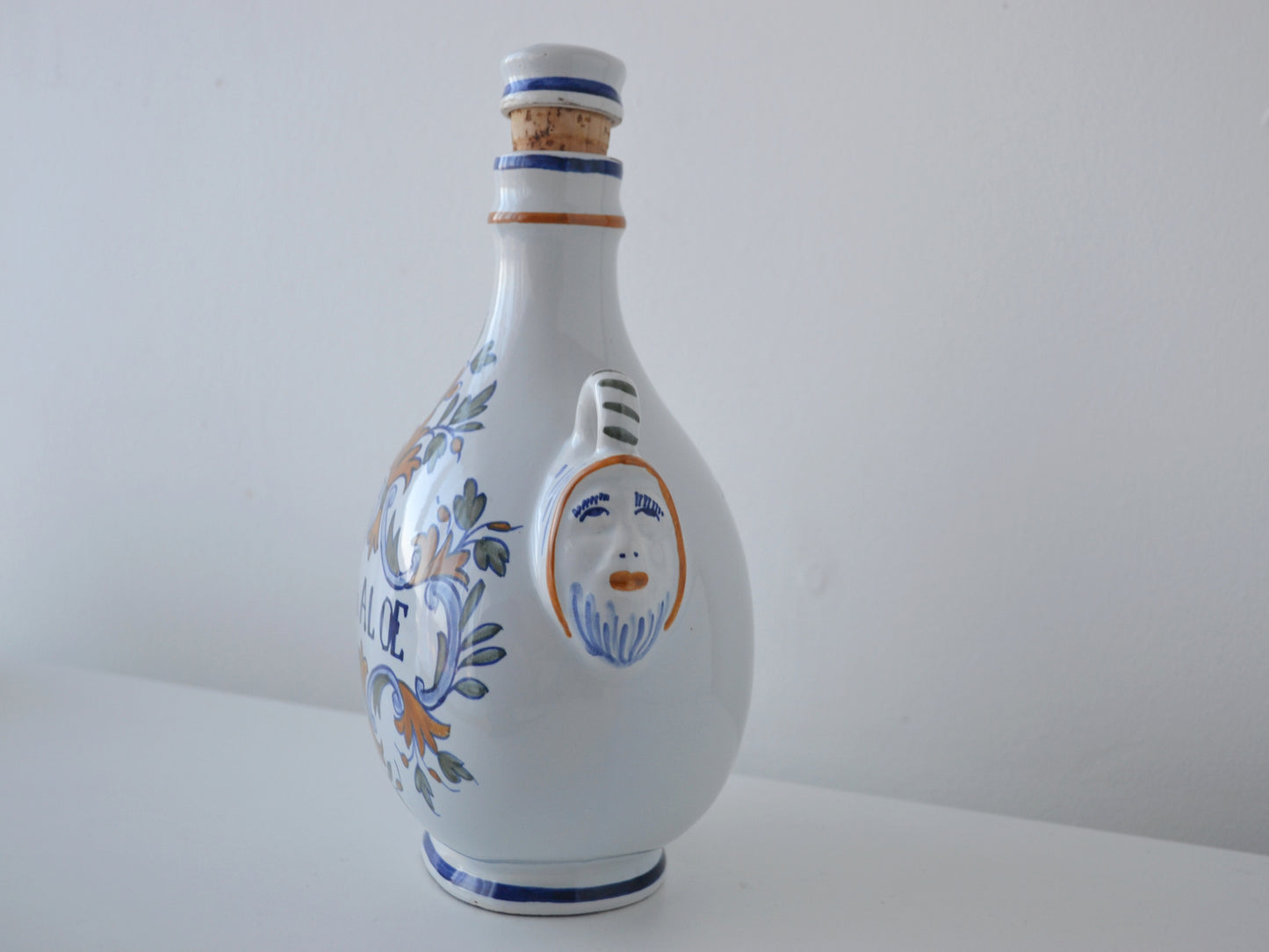 Hand-painted foliate decoration detail, French faience apothecary albarello P. de ALOE, circa 18th–19th century.