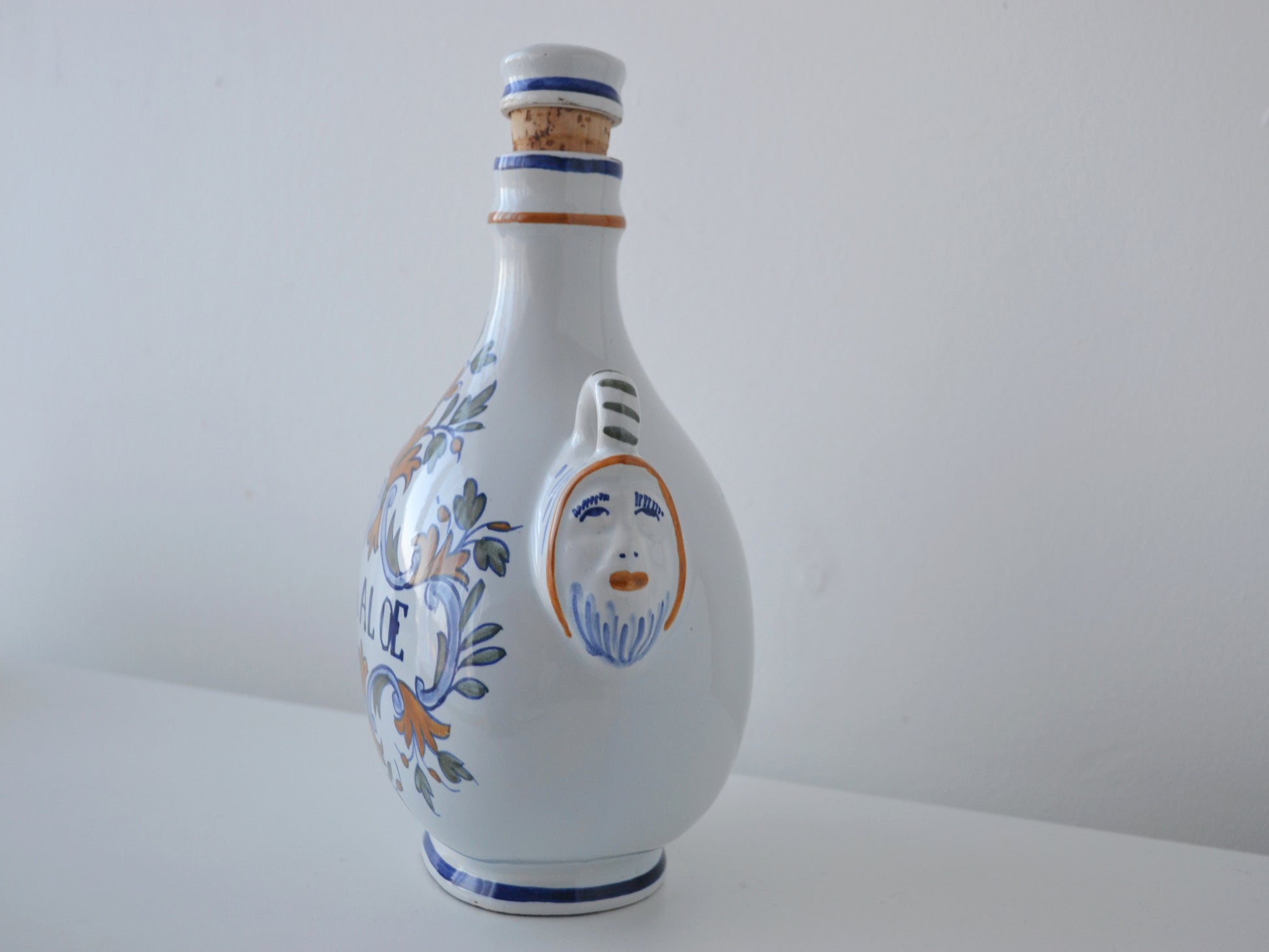 Hand-painted foliate decoration detail, French faience apothecary albarello P. de ALOE, circa 18th–19th century.