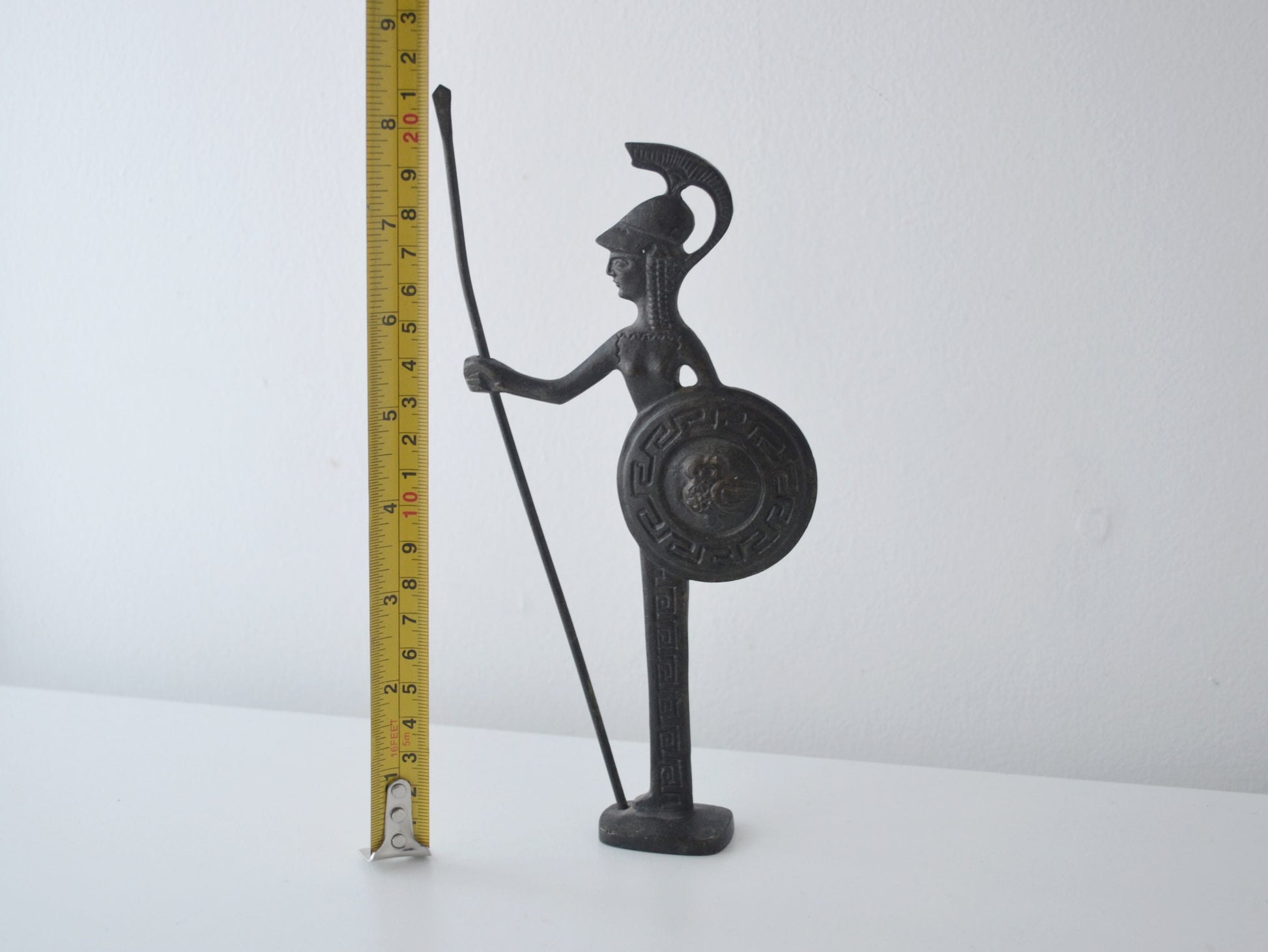 Height measurement of vintage Greek bronze Athena figurine showing 21cm, dark natural patina