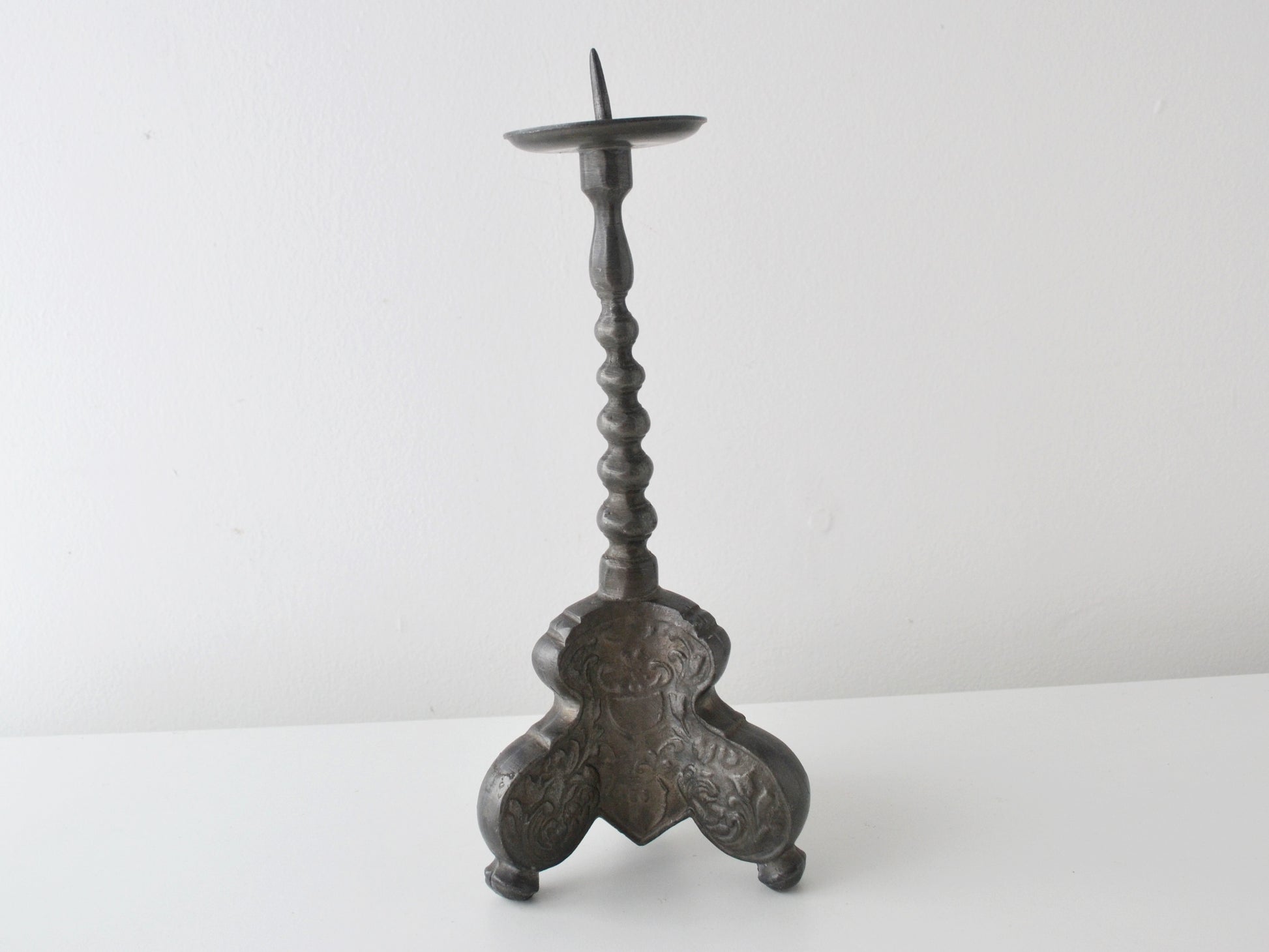 Baroque pewter pricket candlestick, tripod acanthus base, Europe circa 18th–19th century, front view.