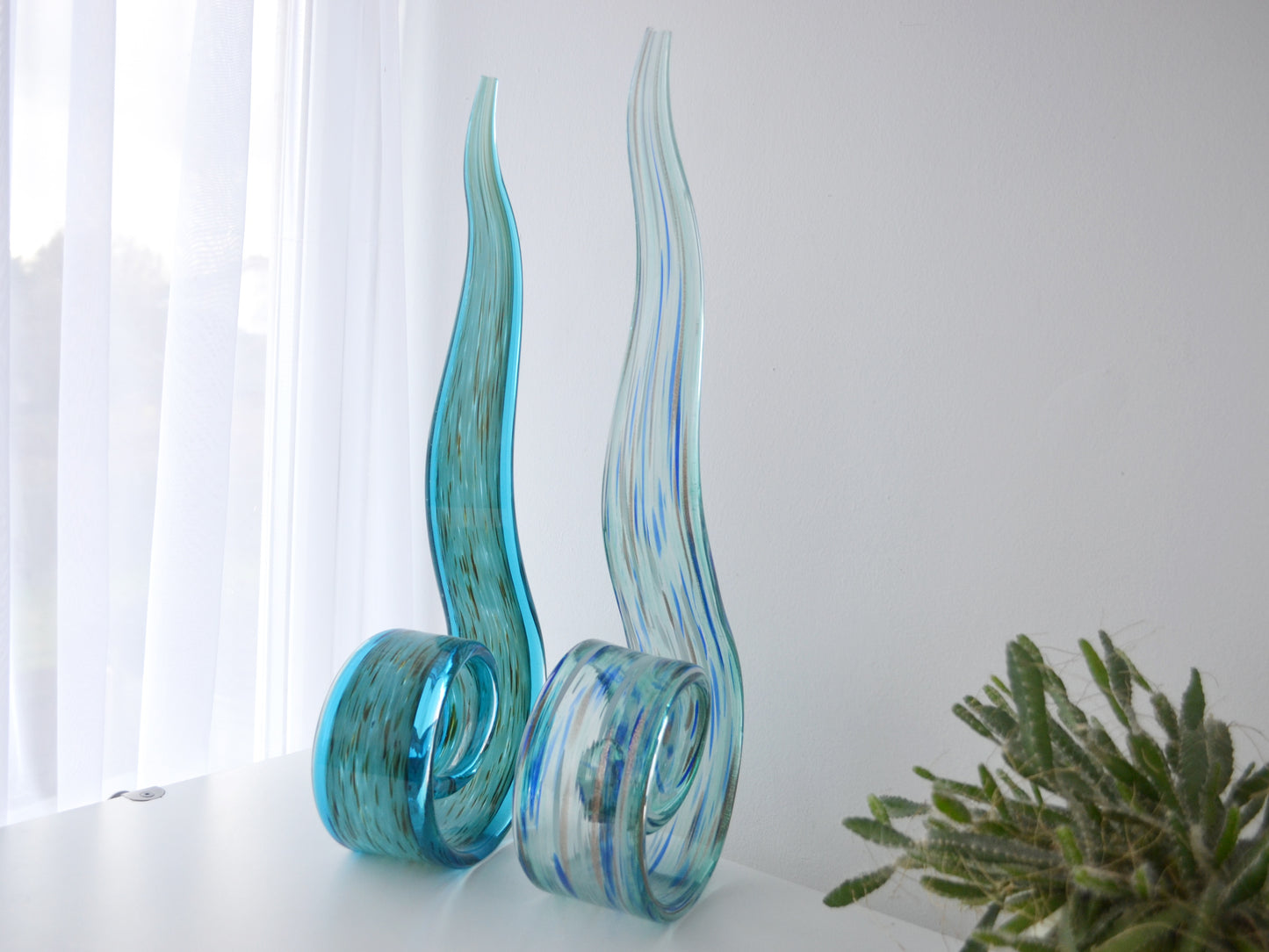 Aventurine and blue threading detail of hand-blown aqua glass swirl sculpture, Italian Murano style, circa 1990s.