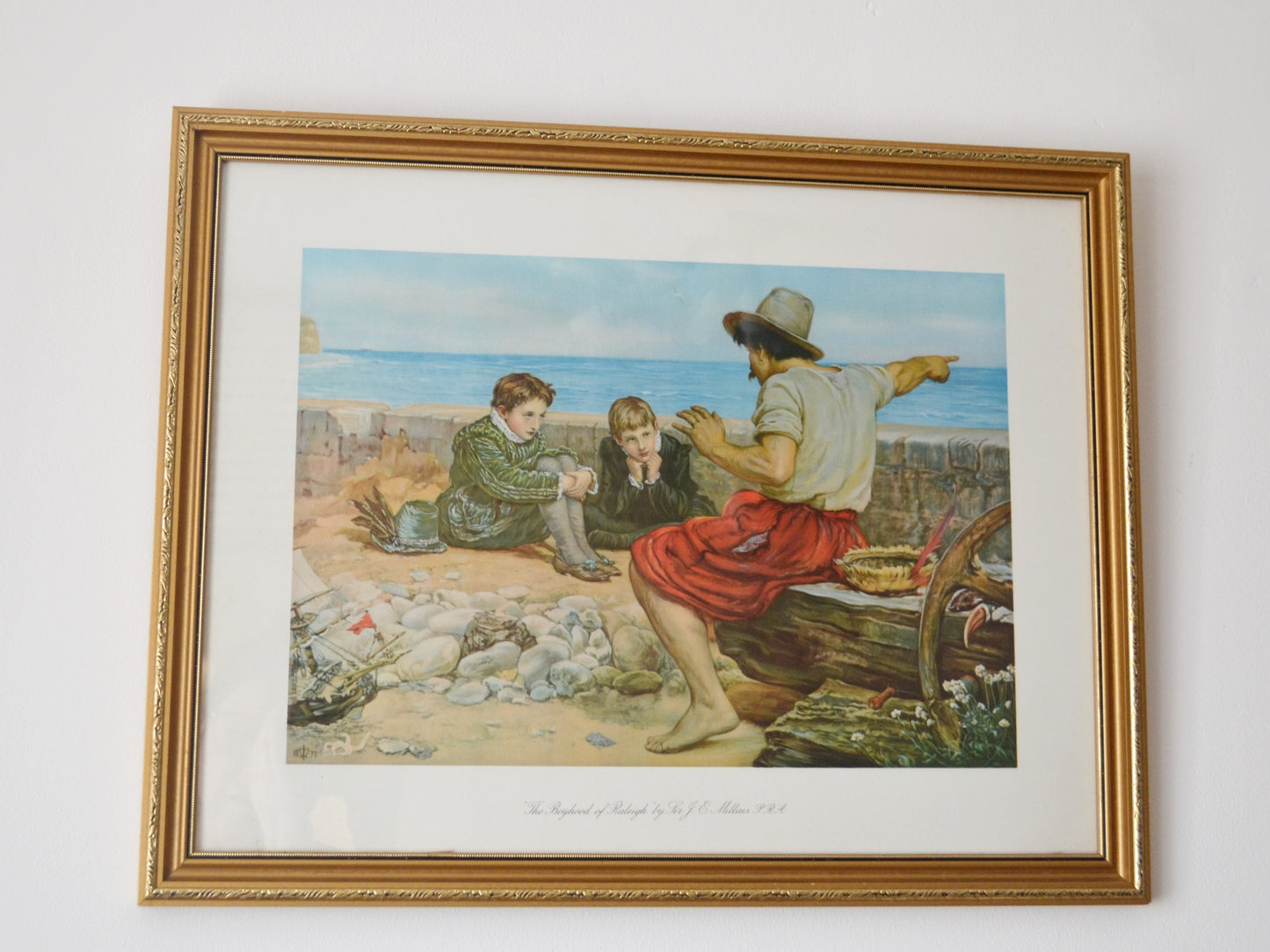
Framed chromolithograph of The Boyhood of Raleigh by Sir J.E. Millais PRA, gilt wood frame, England 1932, front view