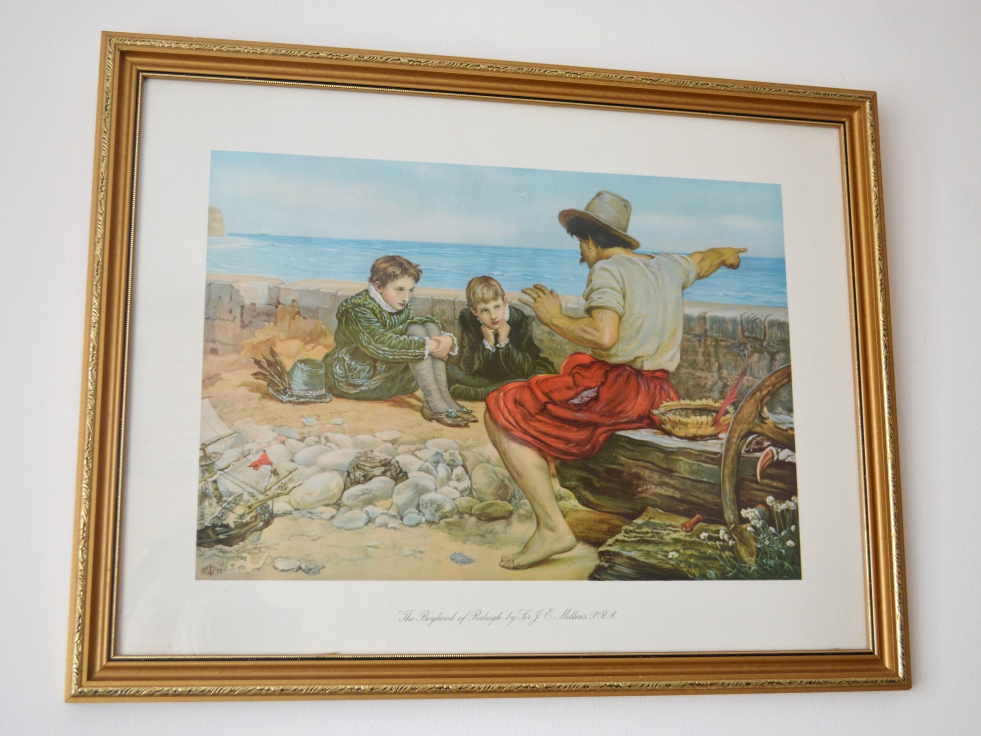 The Boyhood of Raleigh by Millais, chromolithograph detail, sailor pointing to sea, two boys listening, England 1932.