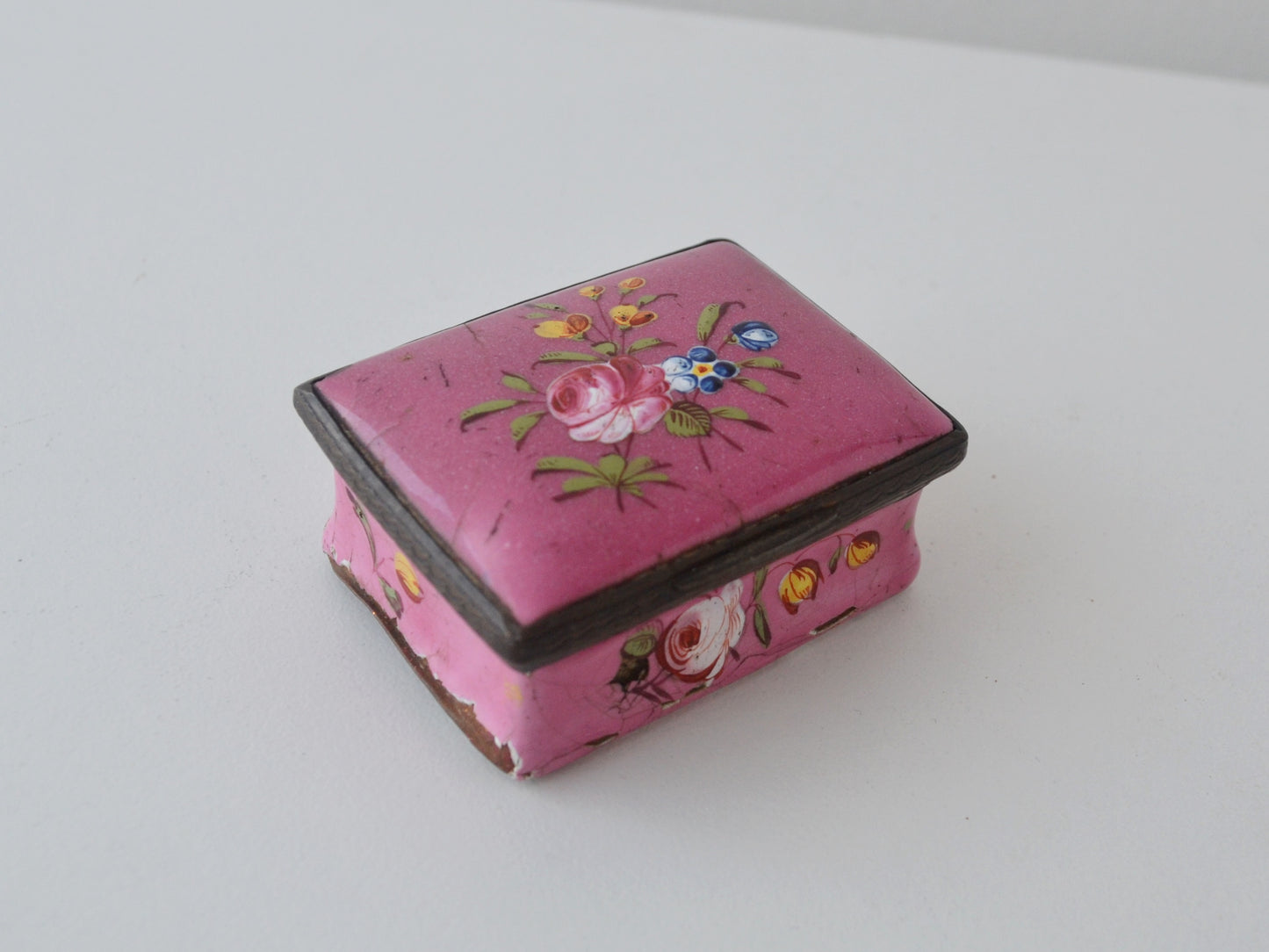Detail of hand-painted rose and forget-me-not bouquet on Georgian enamel box, circa 1770s.