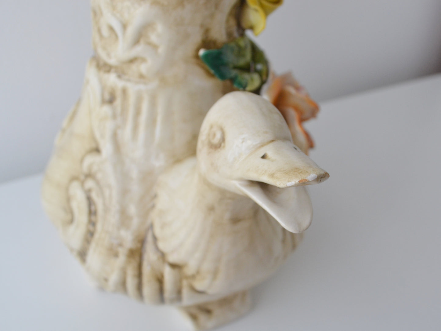 Minor chip to duck beak tip on Capodimonte jug, visible in listing photos
