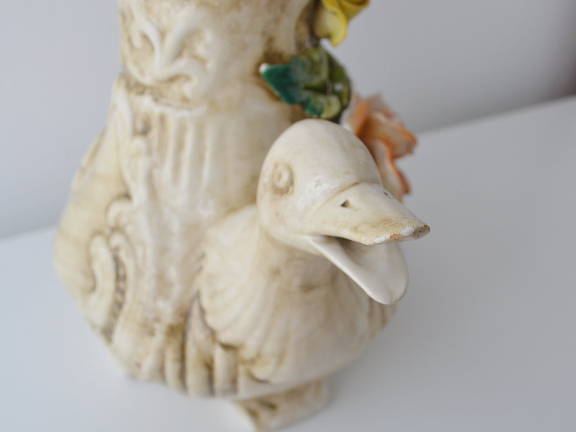 Minor chip to duck beak tip on Capodimonte jug, visible in listing photos