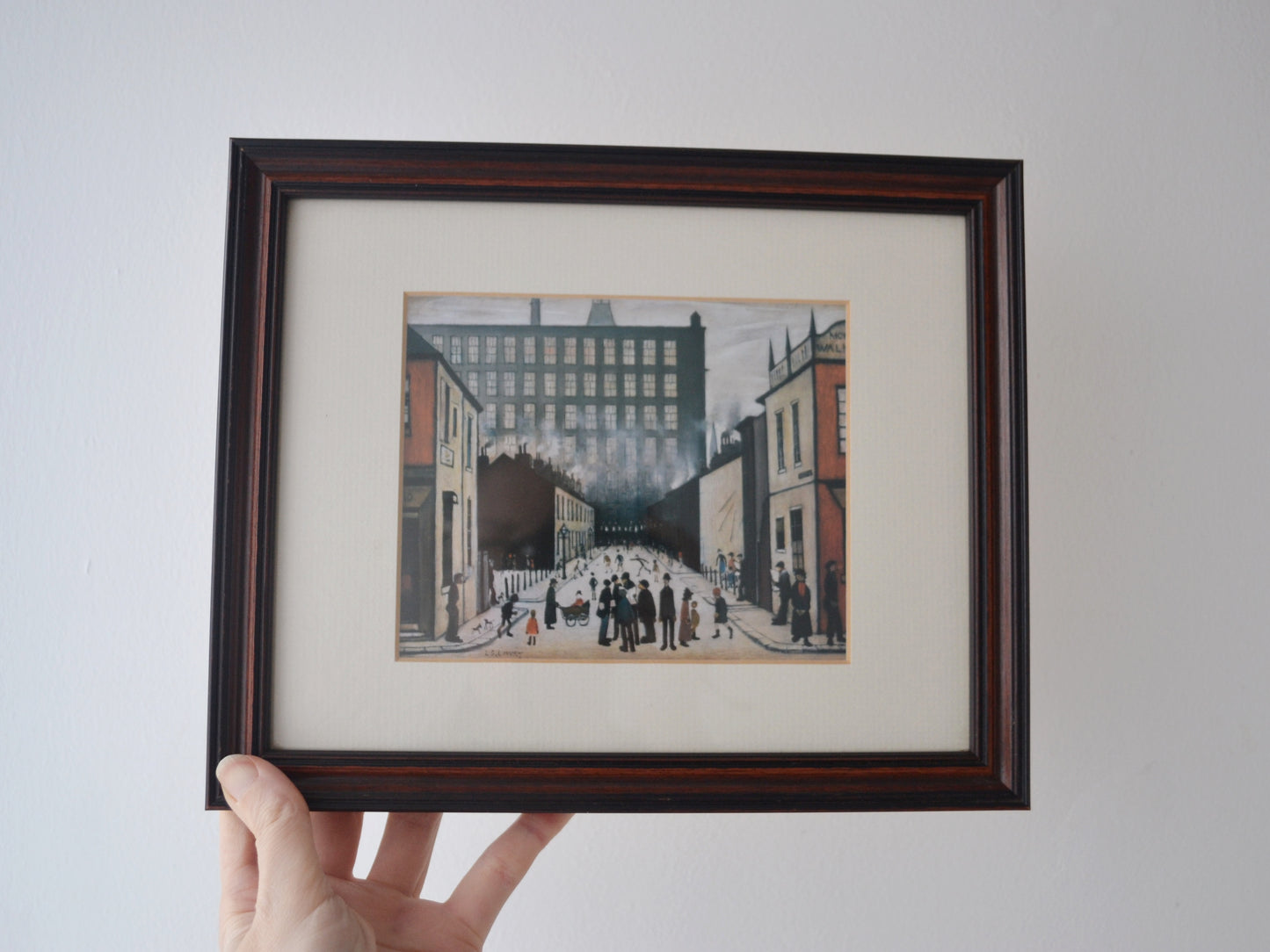 Detail of L.S. Lowry Street Scene Pendlebury colour reproduction print in vintage solid dark wood frame with cream mount, after 1935 original.