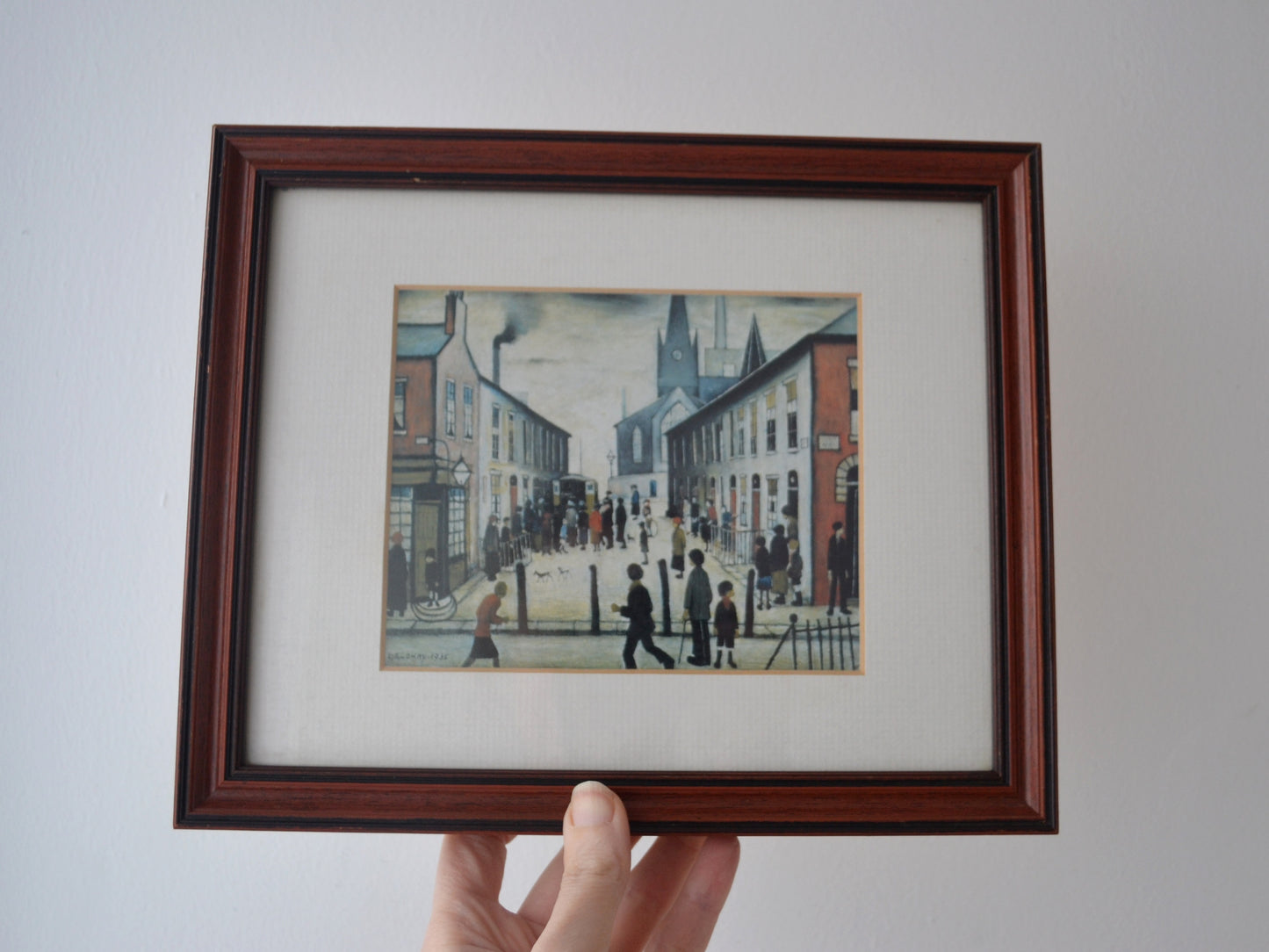 Detail of L.S. Lowry Fever Van colour reproduction print in vintage solid dark wood frame with cream mount, after 1935 original.