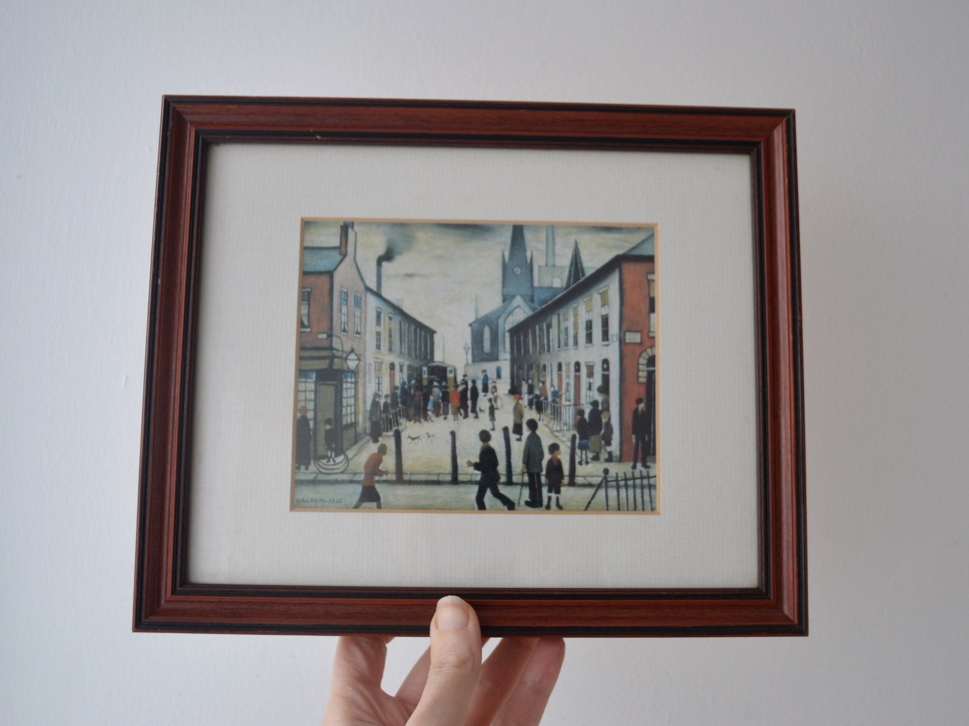 Detail of L.S. Lowry Fever Van colour reproduction print in vintage solid dark wood frame with cream mount, after 1935 original.