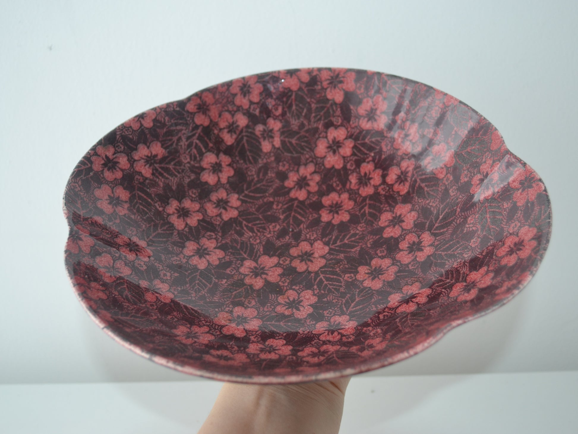 Royal Winton Grimwades dark burgundy chintz footed bowl, scalloped rim, three-quarter view, England circa 1930s