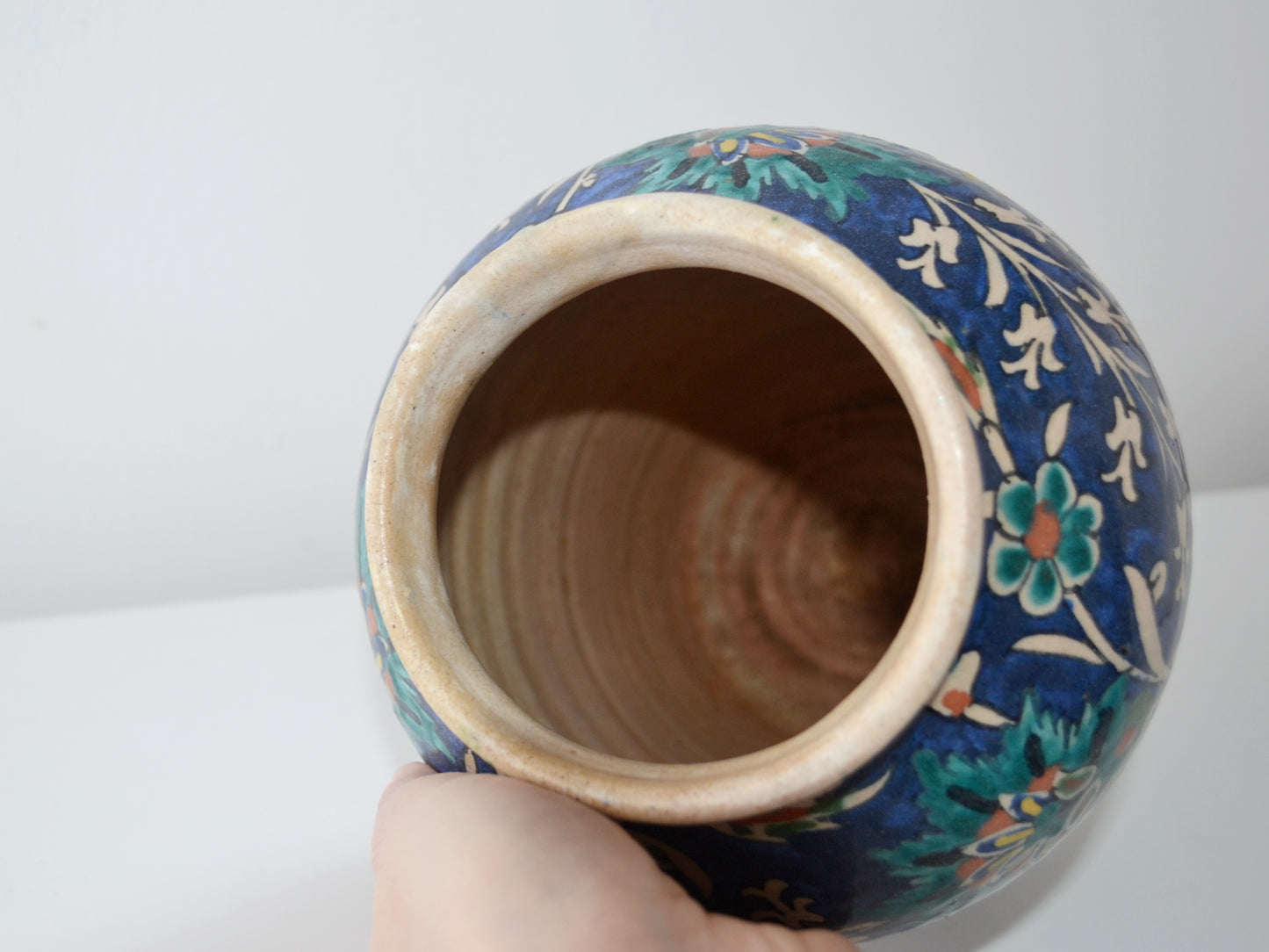 Detail of Armenian Palestinian Pottery vase showing hand-painted tulips carnations and saz leaves on cobalt blue, Jerusalem circa 1930s