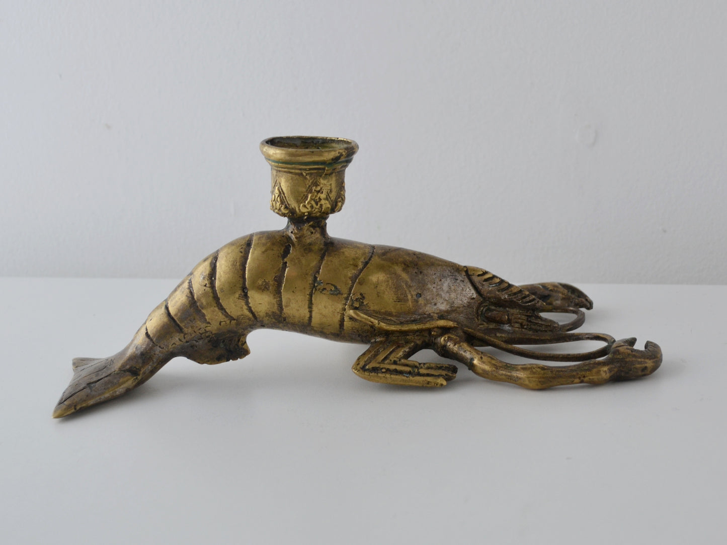 Brass figural lobster candlestick, Hollywood Regency, detailed segmented body and articulated claws, three-quarter view, circa 1960s