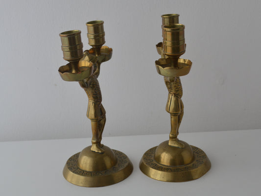 Cast brass Empire figural candelabra, armoured soldier with extended arms, domed engraved base, side view, circa 1900