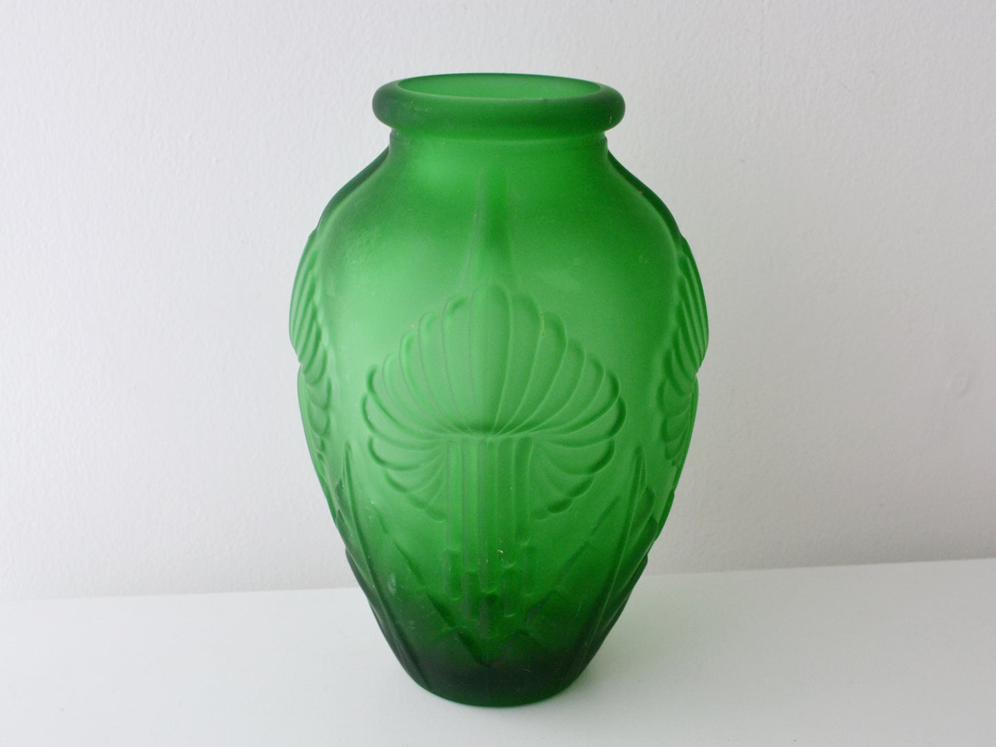 Green satin Art Deco glass vase, calla lily relief pattern, France circa 1920s, front view.